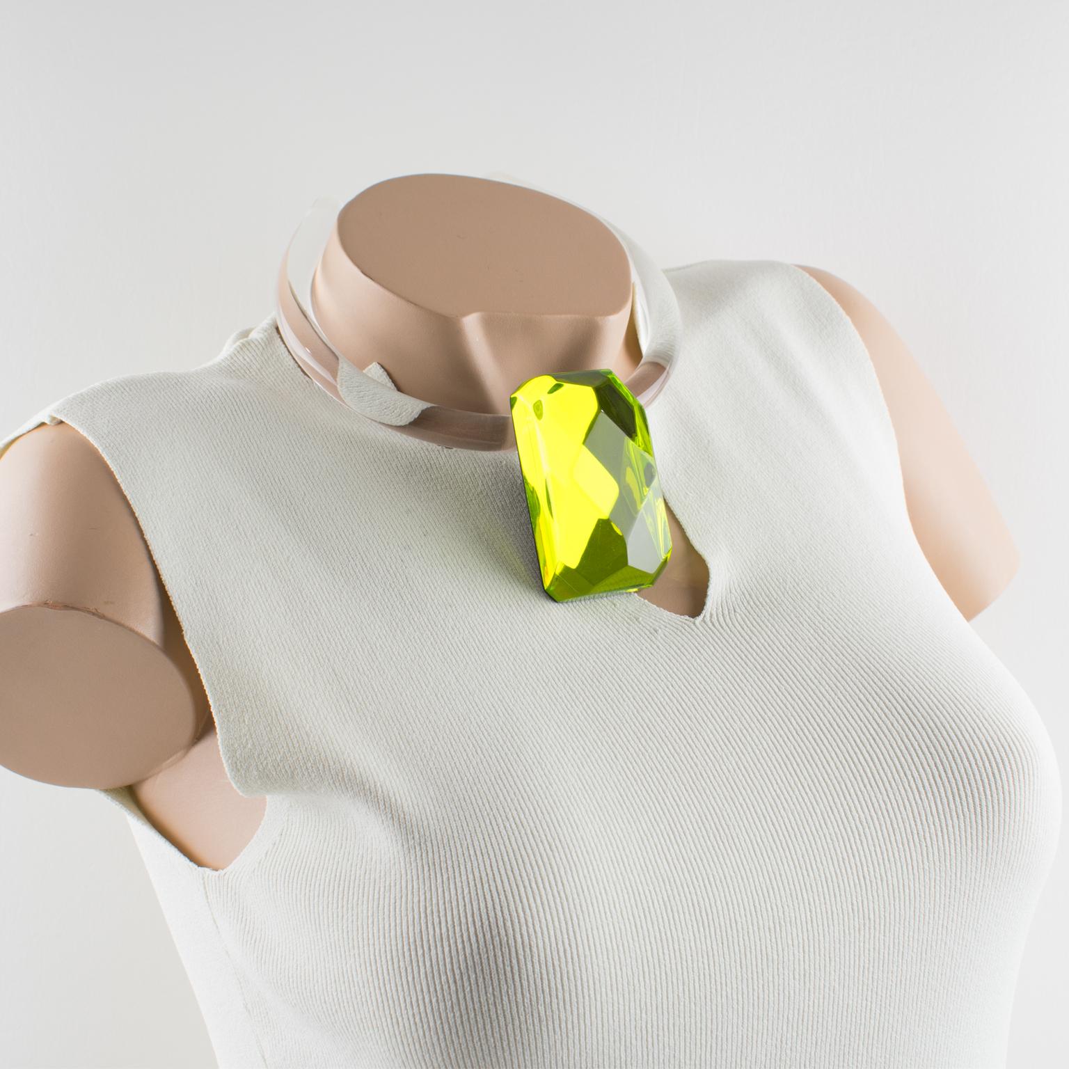Harriet Bauknight for Kaso designed this spectacular Lucite or acrylic choker necklace in the 1980s. The rare piece features a clear, round molded choker contoured to the neck and adorned with a removable pendant. The rigid band has some slight