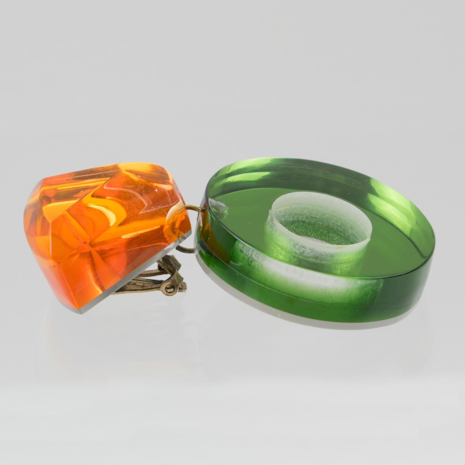 Women's or Men's Kaso Lucite Clip Earrings Dangle Green and Orange Donut For Sale