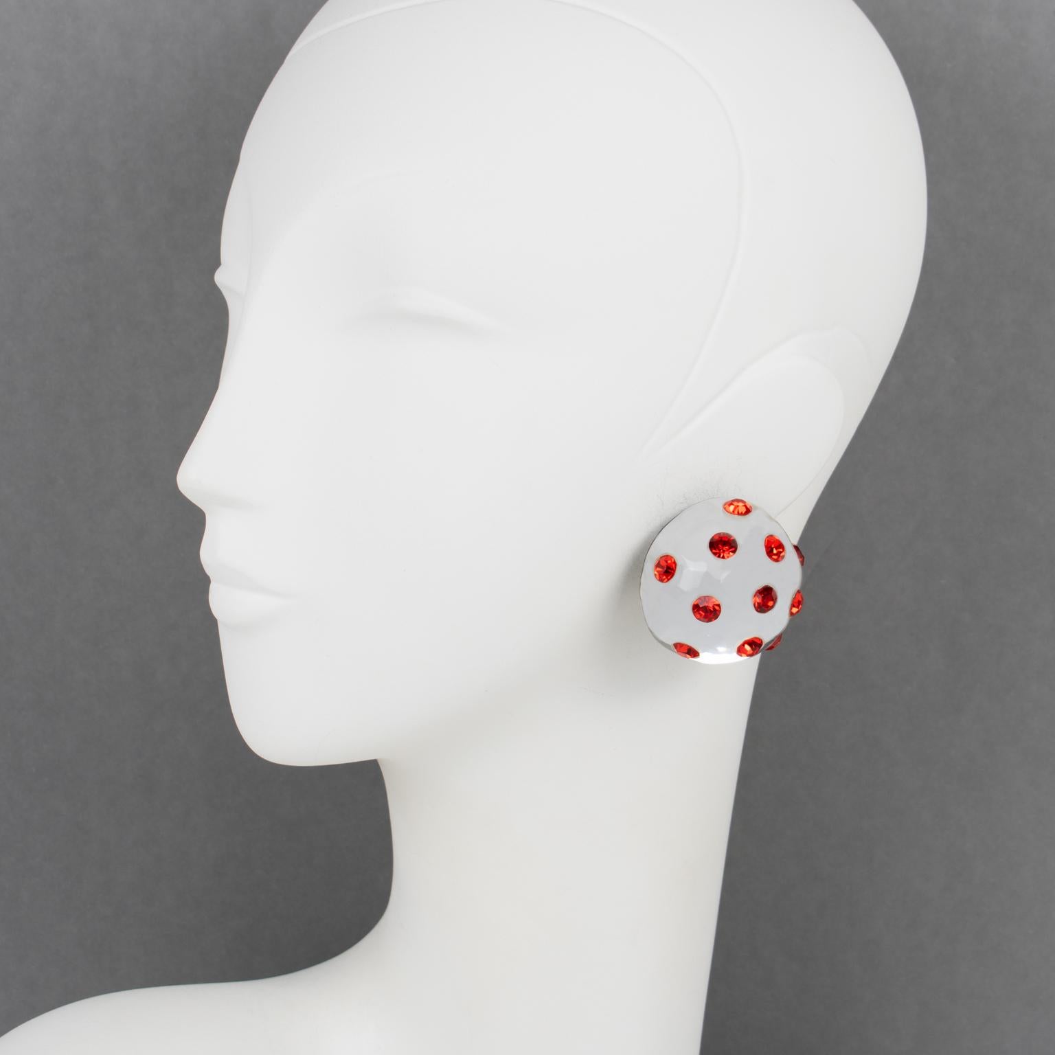 Harriet Bauknight designed these beautiful Lucite clip-on earrings for Kaso. They feature a dimensional carved round domed shape in silver color with mirror textured pattern, all paved with fire orange crystal rhinestones.
The Kaso paper sticker was