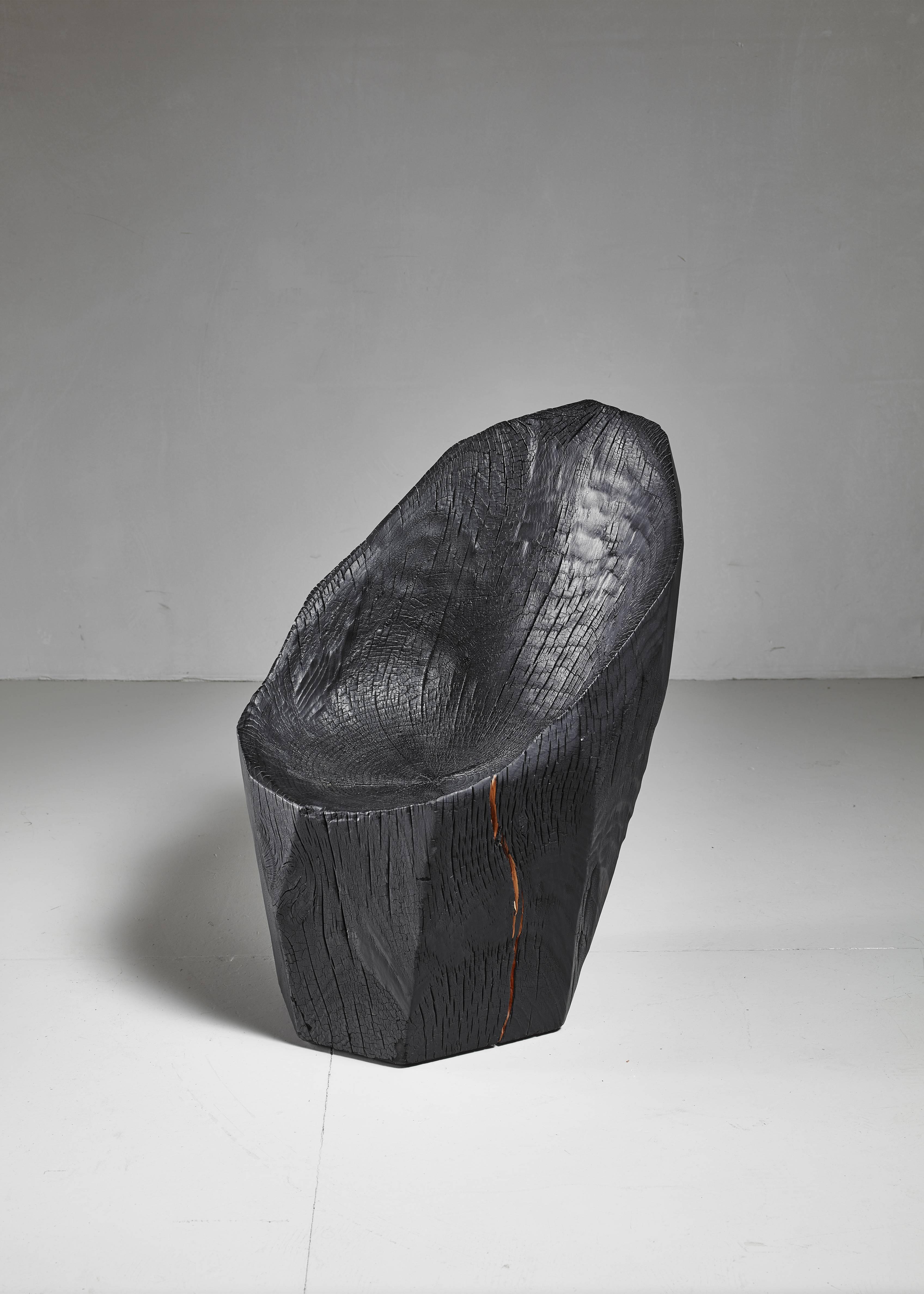 An 'Ausgebrannt' chair made from a solid piece of oak from a naturally fallen tree by Belgian artist Kaspar Hamacher.

Hamacher (1981), son of a forester, uses nature as the main inspiration for his work, with wood being his preferred material.