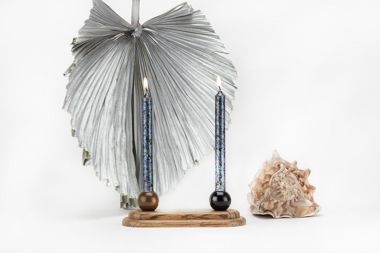 Inspired by a dream about a Memphis table setting and named after the Grecian archetype of female prophecy, Kassandra is a two-candle candelabra. Candle cups are made from spun aluminum that is cold-finished with copper-sparkle and black car paint.