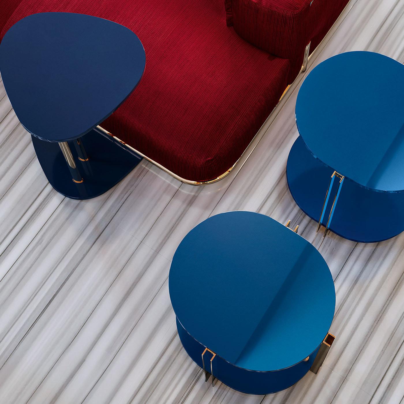 This side table from the Kassel Collection will infuse sophistication into any interior. Channeling a chic modern style, this side table is defined by an identical top and base in lacquered wood in a vibrant cobalt hue enclosed by three sections of