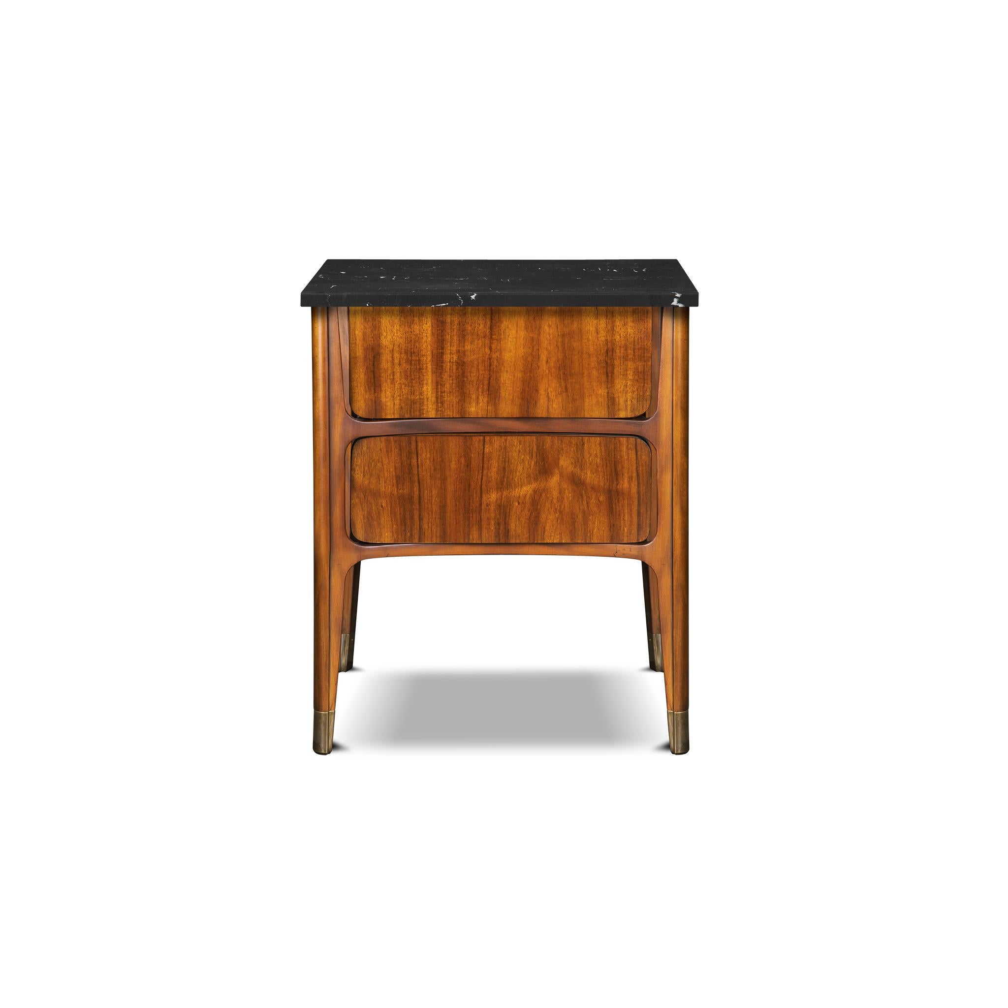 This Kassel Small Chest is as versatile as it is unique. Veneered in koa wood with a marble top, it works perfect as a nightstand or as a side table. The drawers are curved inwards creating an interesting visual effect and has tapered legs that are