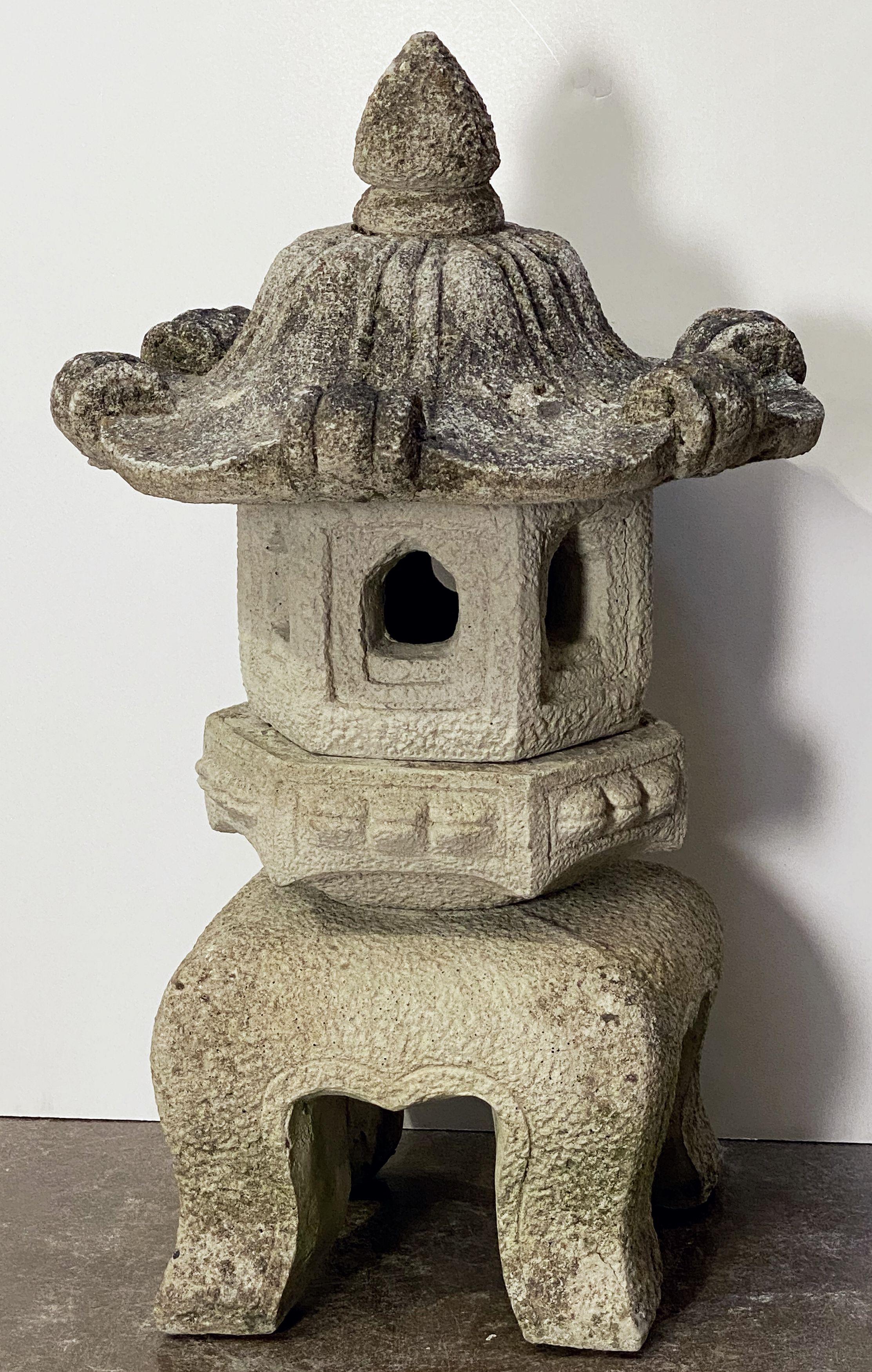 A Kasuga lantern of composition stone, from England, featuring a removable top lid in the shape of a pagoda, and hollowed area (for lighting) in bottom section.

Named for the stylized lanterns at the Kasuga Grand Shrine (Kasuga-taisha), a Shinto