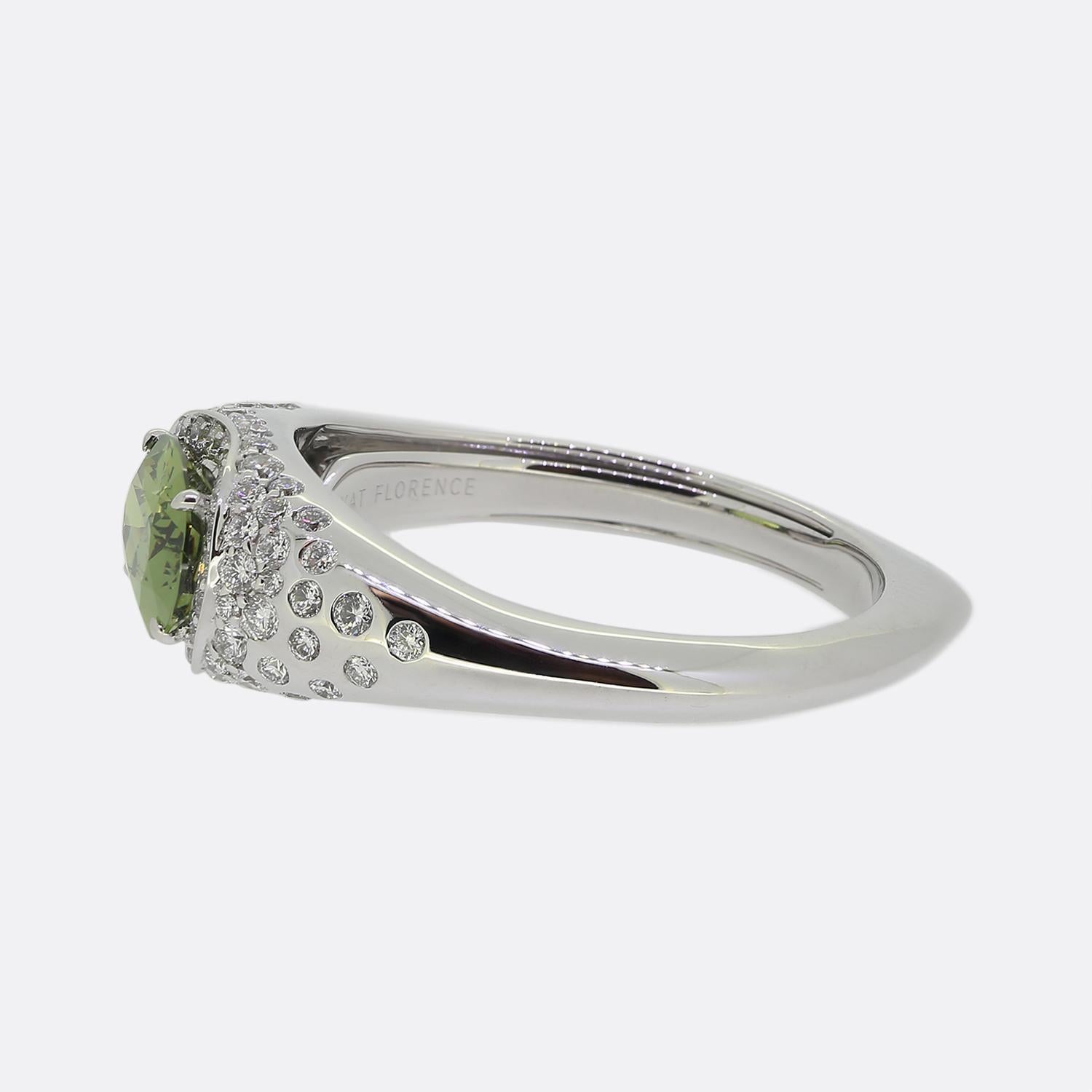 Here we have a gorgeous demantoid garnet and diamond ring from Kat Florence. Famed for her unique designs and use of the world's rarest and most flawless gemstones, this piece is no exception. An 18ct white gold shank plays host to a captivating
