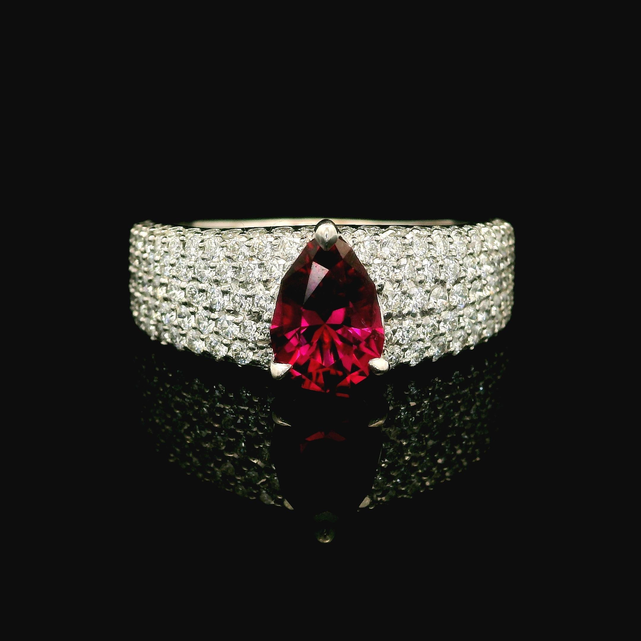 --Stones:--
1 Natural Genuine Rubellite Tourmaline - Pear Cut - Prong Set - Deep Pink Color - 8.30x5.80mm - 0.95ctw exact
180 Natural Genuine Diamonds -Round Brilliant Cut - Pave Set - D Color - Flawless Clarity - 1.23ctw exact. as per paper
Total