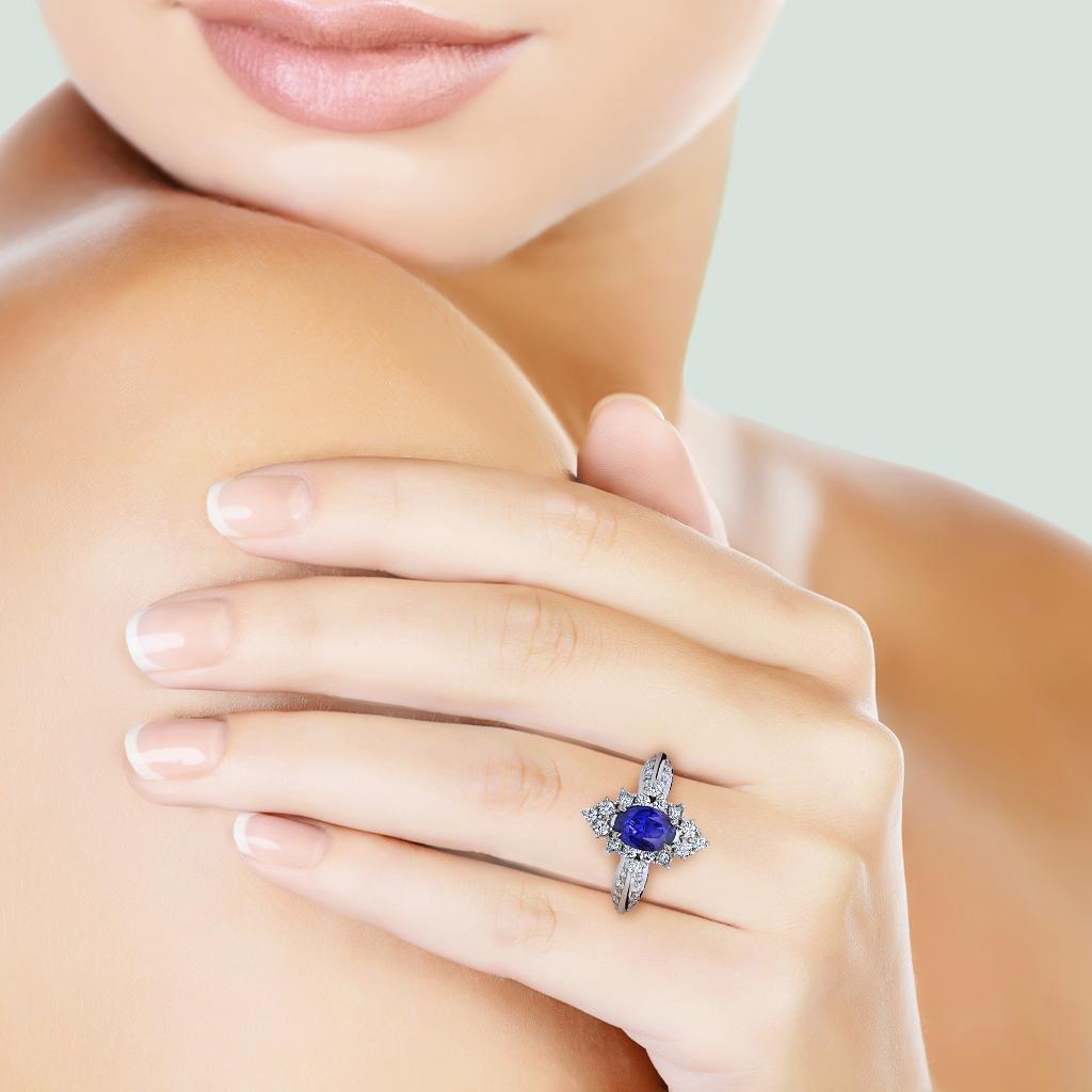 From Designer Kat Florence comes this important unheated 1.36 carat Kashmir sapphire set into 18k white gold with .90 carat total weight diamonds flawless - VVS clarity, D-E Color making this a one of a kind ring to own. Comes with Designer