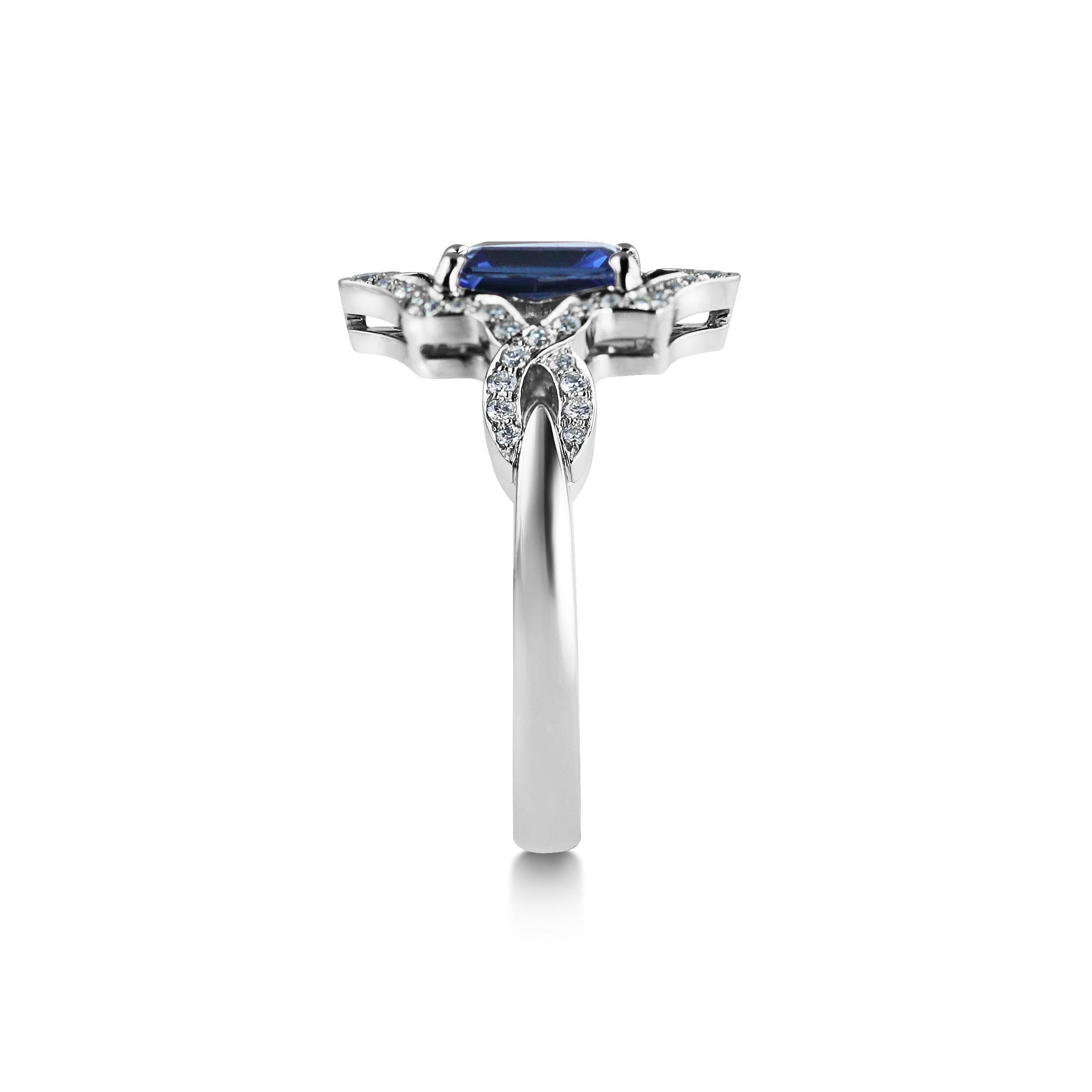 Beautiful as an unusual engagement ring or to wear as a stunning dress ring.  
This ring features a 0.92ct Deep Blue Sapphire suspended between two diamond set paths. 

The matching earrings and pendant are also available to complete the set. 

The