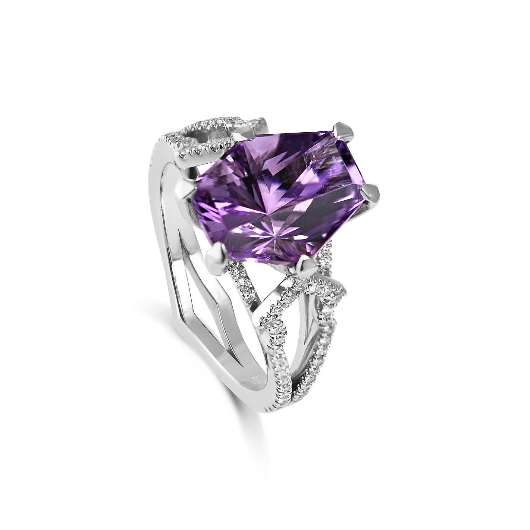 Our Asteria Ring is a 1 of 1 collection showpiece.

Firstly, we had the central amethyst uniquely cut by our Lapidary craftsmen. It exudes an otherworldly quality, its facets drawing you in to another dimension. You will not find its match anywhere,