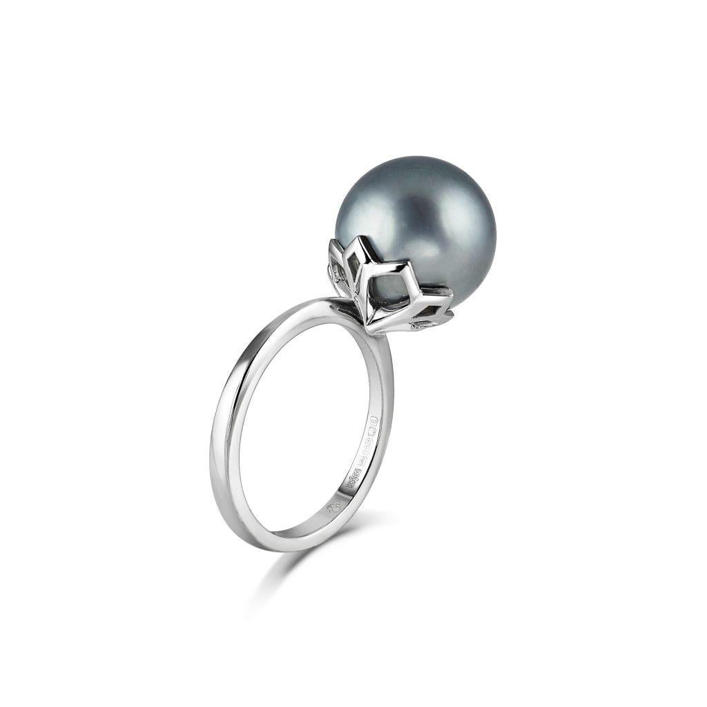 Padma Ring - Tahitian Pearl

A stunning natural silver-grey Tahitian Pearl held in a beautifully pierced lotus-shaped cap.

The beautiful Padma ring is handmade in 18ct White Gold and is available to ship immediately.

If you love the look but would