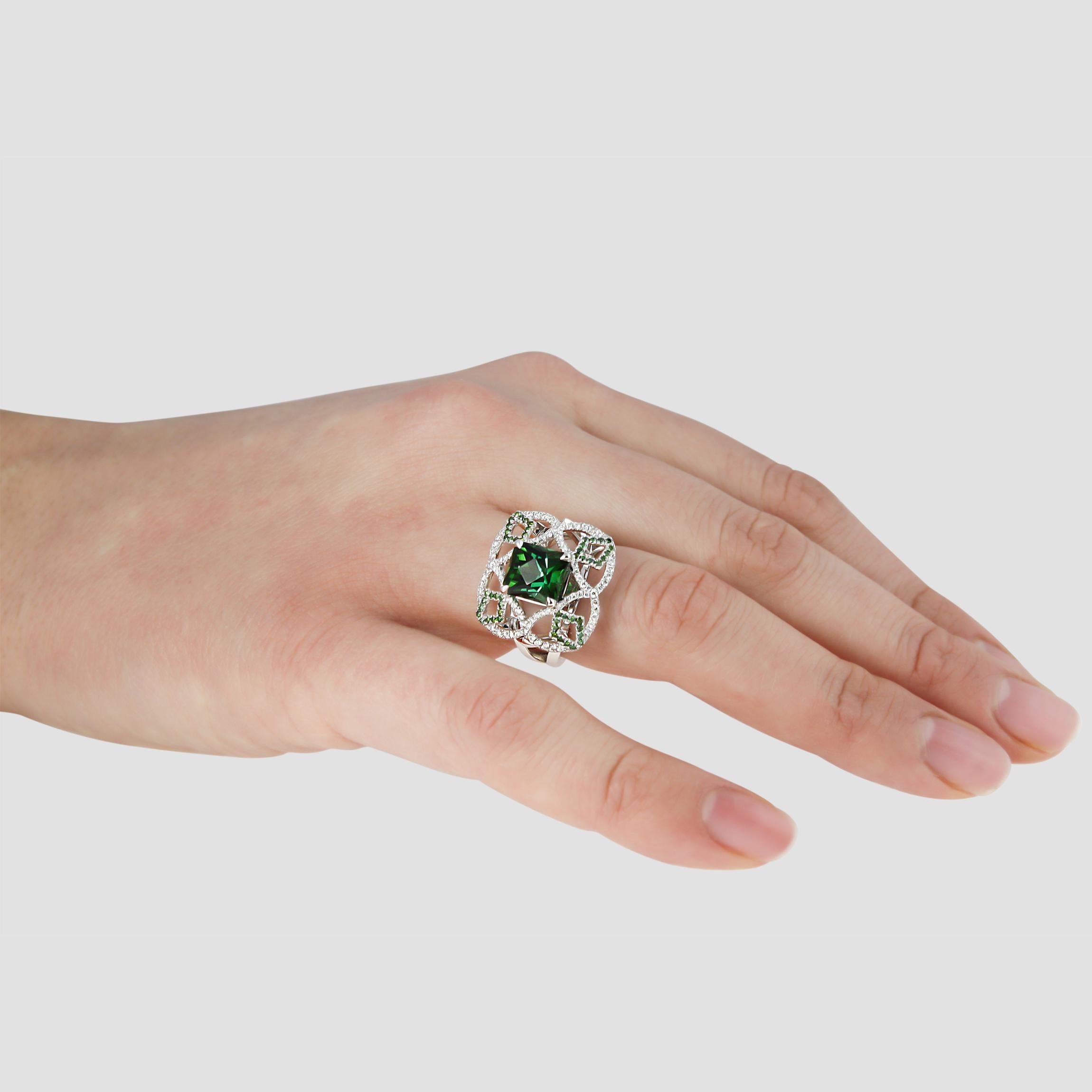 Our Pomona Ring is a 1 of 1 collection showpiece.

When creating this ring we started with the gemstone. The rich green tourmaline was uniquely cut by our lapidary craftsmen. The unusual facets draw the gaze with its many tones and depths.

We then