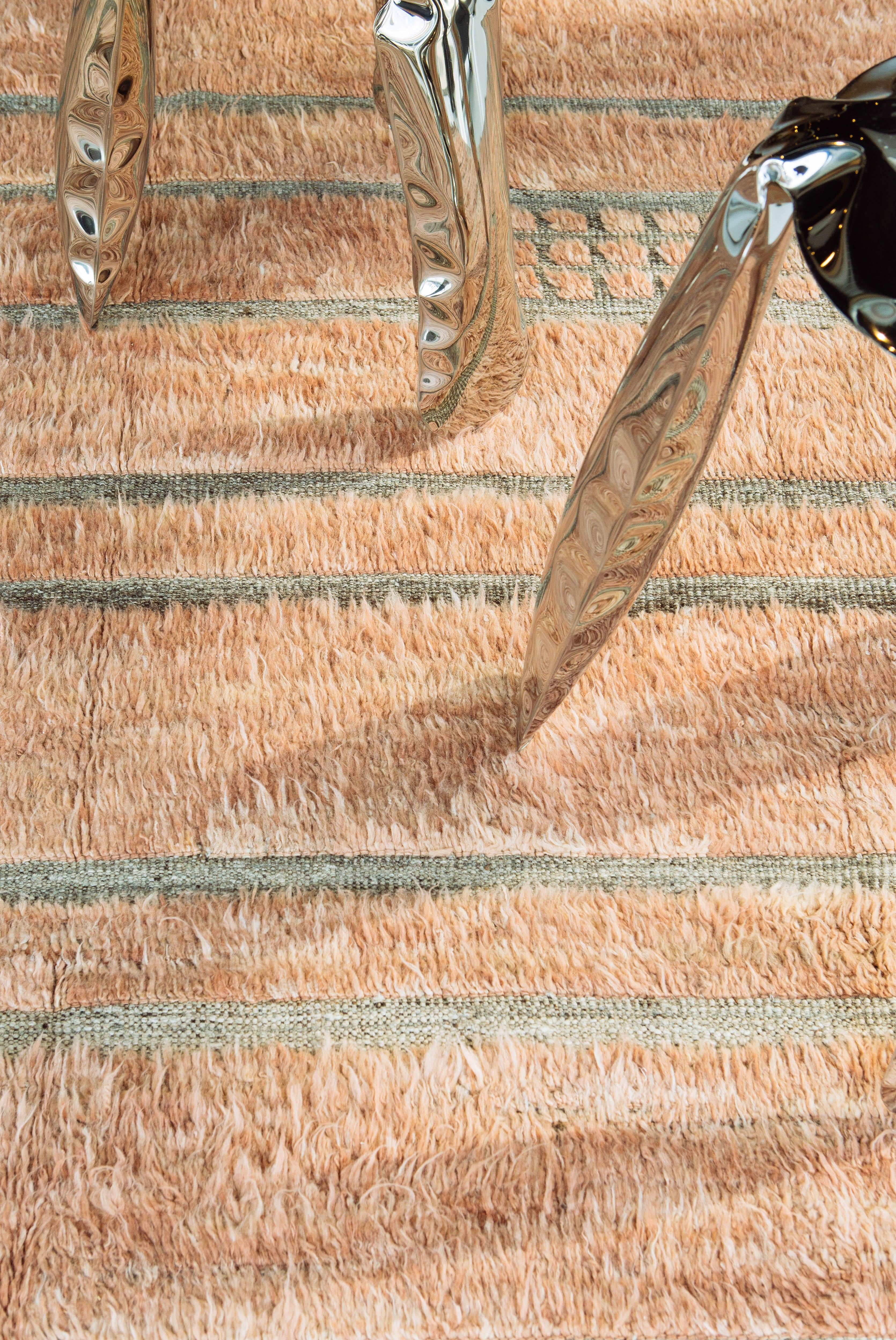Katabatic is handwoven of salmon colored shag and a natural taupe flat-weave. Designed in Los Angeles with immense detail, Katabatic is meant to be lived on and can withstand high amounts of foot traffic. 

Rug number: 28137
Size: 9' 6