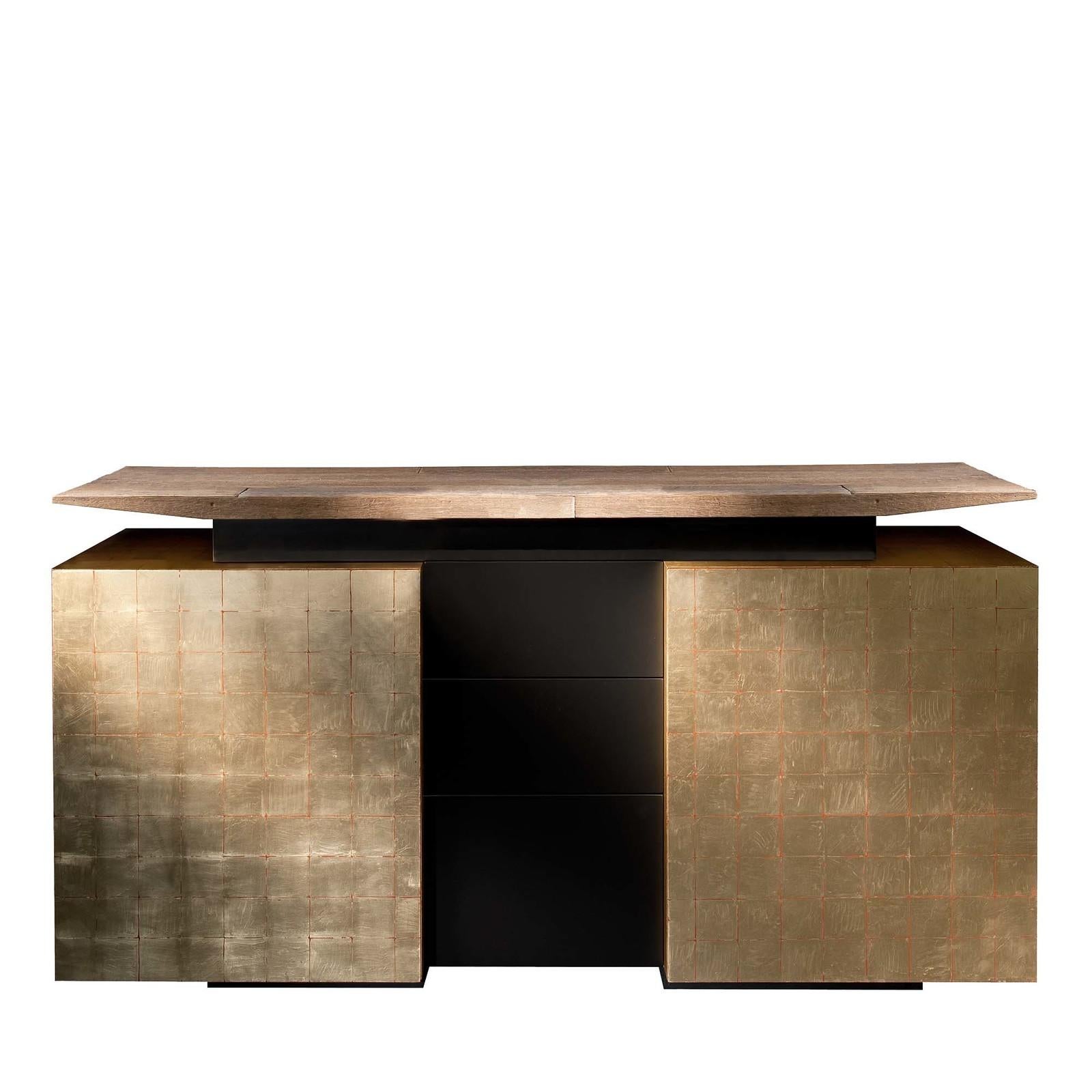 Pairing function with style, this superb cabinet offers room to stage and store entertaining essentials. The design boasts clean lines in a harmonious combination of textures. Floating from the structure below finished in gold leaf, the top is