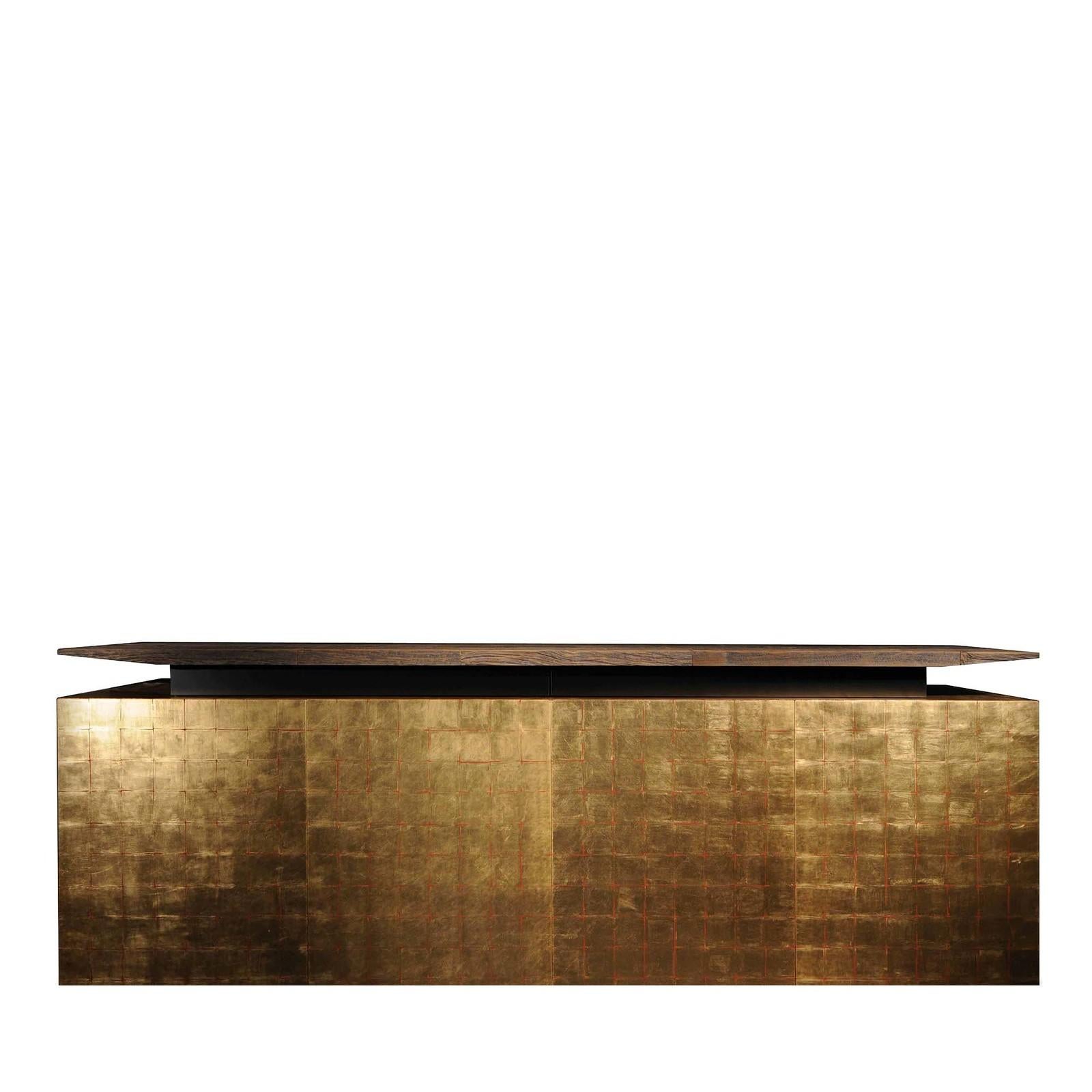 Simple, pure, glamorous: this stunning cabinet defies fleeting trends with its timeless elegance and unique characteristics. The linear silhouette includes a lower section with four soft-close doors finished in gold leaf (also available in silver