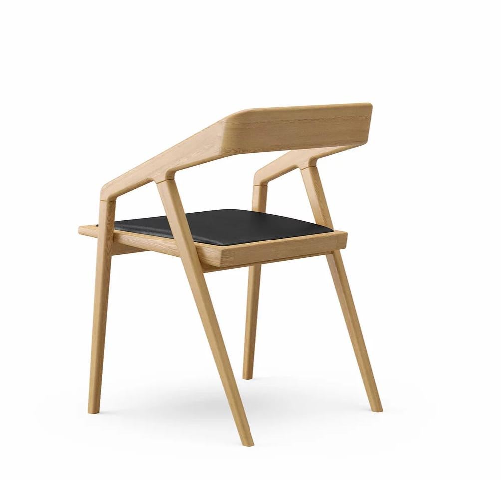 Katakana dining chair by Dare Studio, 2009
Dimensions: H 75.6 x D 56.4 x W 57 cm
Materials: European white oak, black leather

Also available in American black walnut, Wax oiled finish. 
All pieces are available in different fabrics and