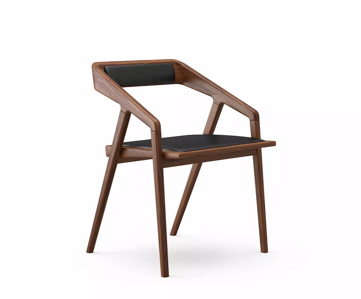 Katakana dining chair by Dare Studio, 2009
Dimensions: H 75.6 x D 56.4 x W 57 cm
Materials: American black walnut, black leather

Also available in European white oak, wax oiled finish. 
All pieces are available in different fabrics and