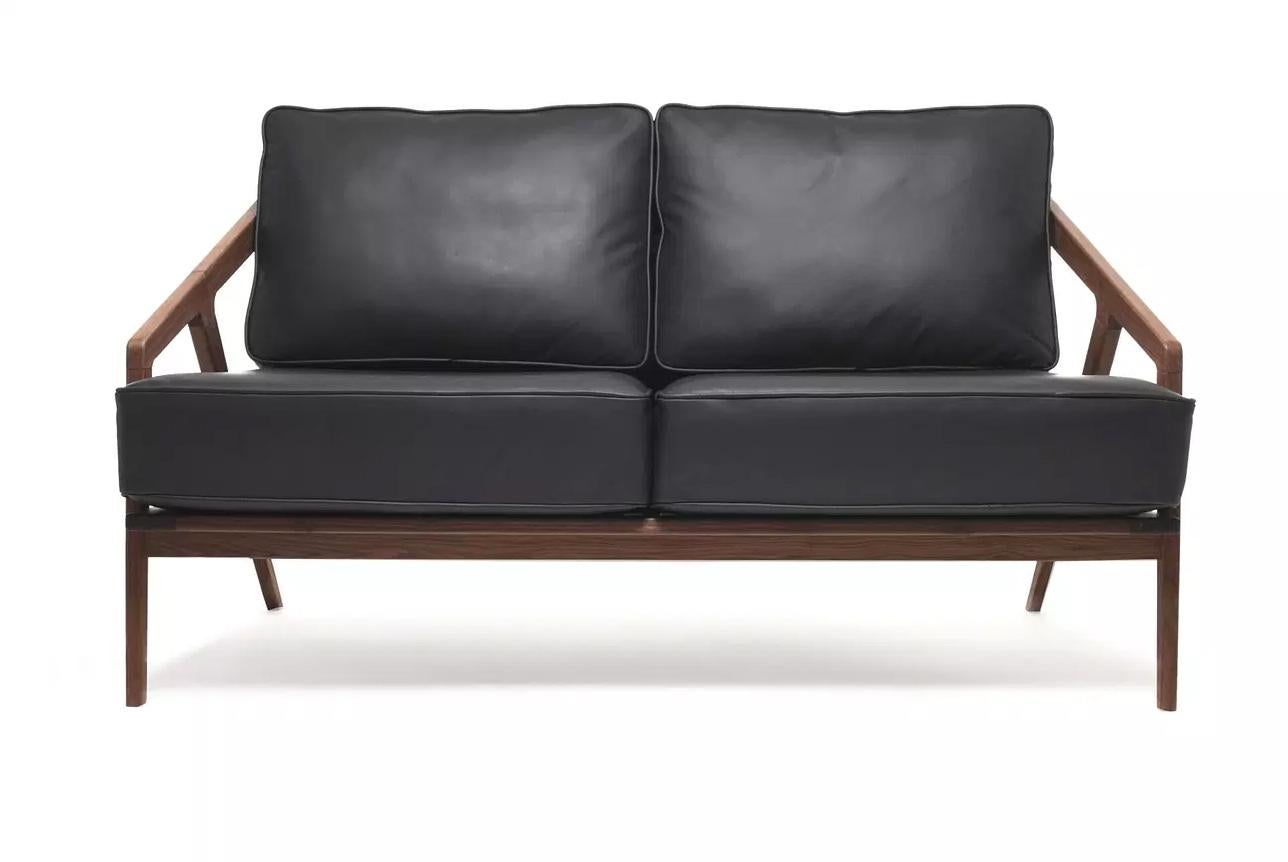 Katakana lounge chair by Dare Studio, 2009
Dimensions: H 79 x D 82.8 x W 72 cm
Materials: European white oak, black leather
Features: Can be used in vertical or horizontal positions

Also available in American black walnut and wax oiled