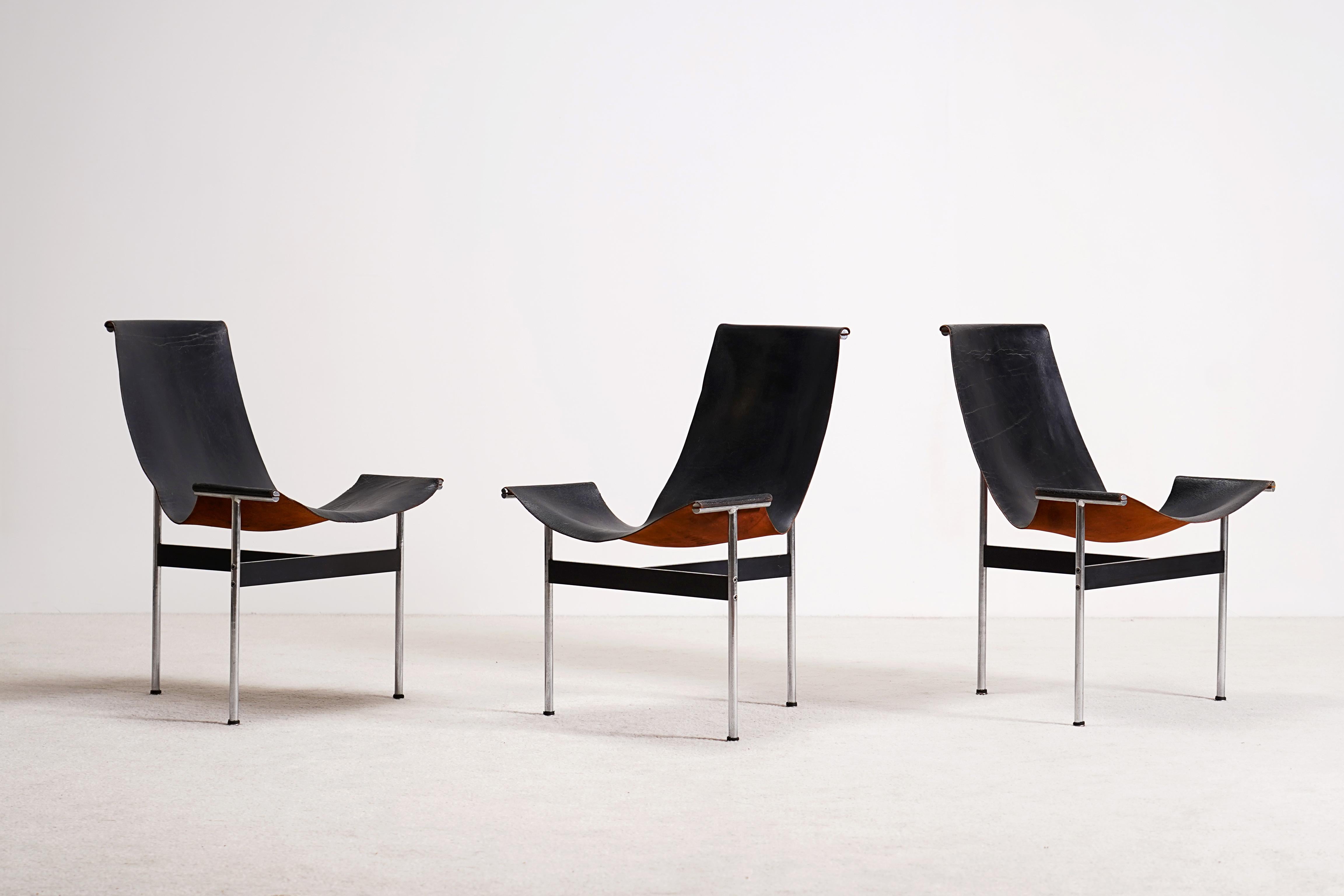 Set of 3 three-legged chairs, model T-Chair, designed by Katavolos, Kelley and Littell in 1952 / 1953. Three T-shaped steel legs hold the black leather in place. The leather is connected to the frame on three points only resulting in an elegant
