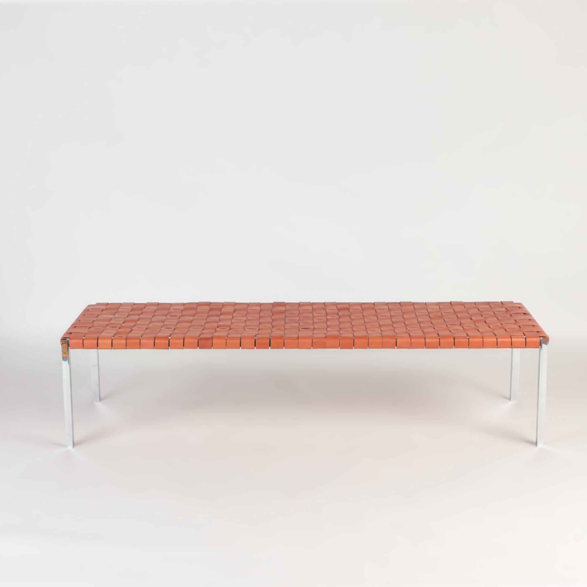 The TG-18 long woven leather bench was designed by Katavolos, Littell and Kelley in 1952 as part of the original Laverne Collection produced by Gratz Industries, formerly known as Trietel-Gratz.
