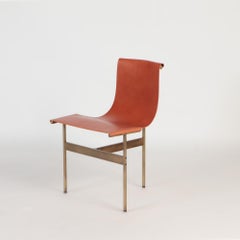 Katavolos Littell and Kelley. Set of four tan leather sling chairs.Contemporary
