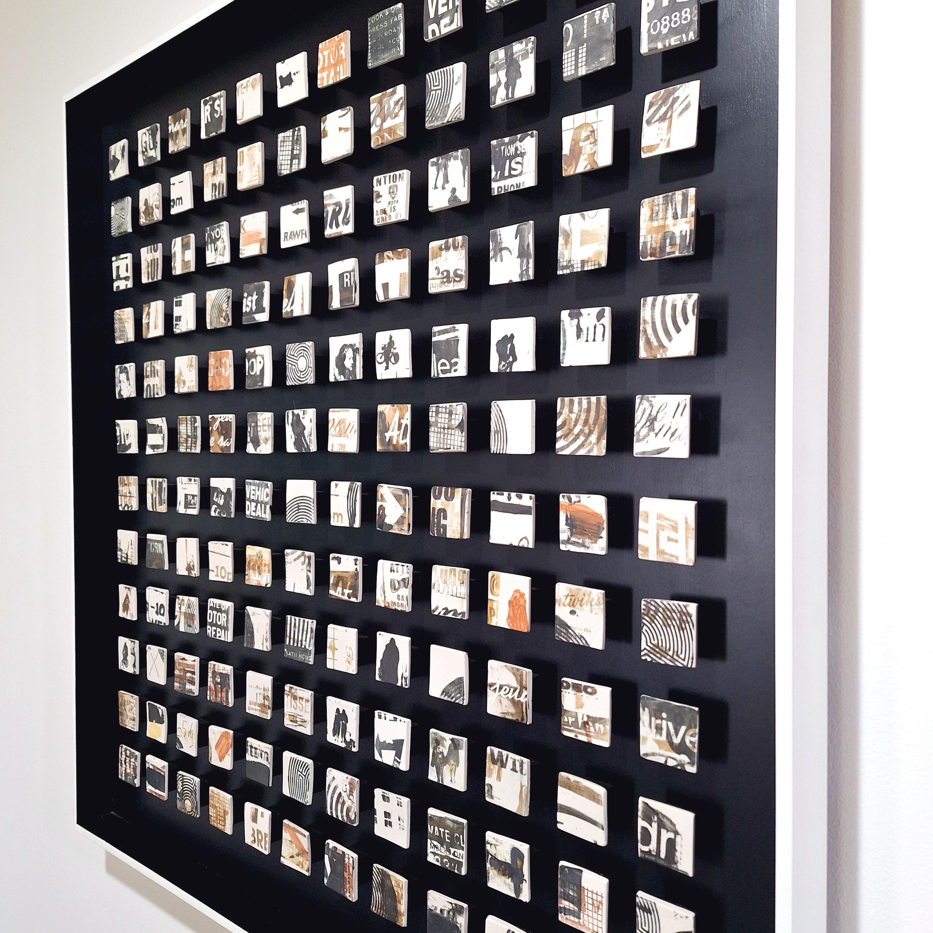 Maze is a unique contemporary modern wall object by British artist Kate Brett. This one of a kind object consists of  144 handmade unglazed porcelain elements mounted in a hand painted matt black frame with a white raised edge. At the rear of the