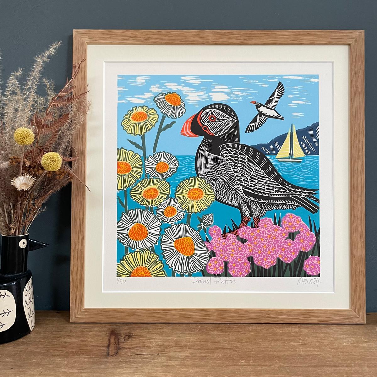 A proud puffin sits on the cliff’s edge amongst the sea thrift and the ox-eye daisies. Linocut Limited Edition of 30 Printed with oil based relief inks on 300gsm soft white Somerset velvet paper.

ADDITIONAL INFORMATION:
Archival Inkjet Print,