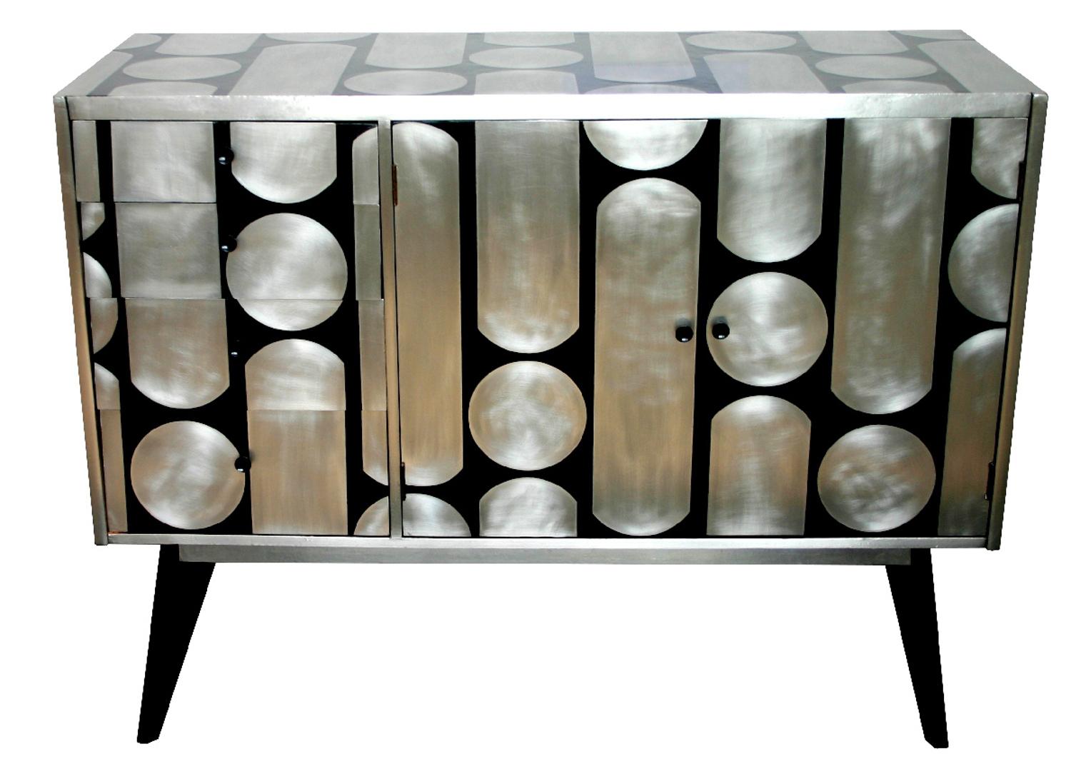 A mid-century sideboard that has been reconditioned and reimagined by designer and maker Kate Noakes. Kate uses a unique process that she has developed of cutting her original designs in sheet metal that are applied onto existing furniture and then