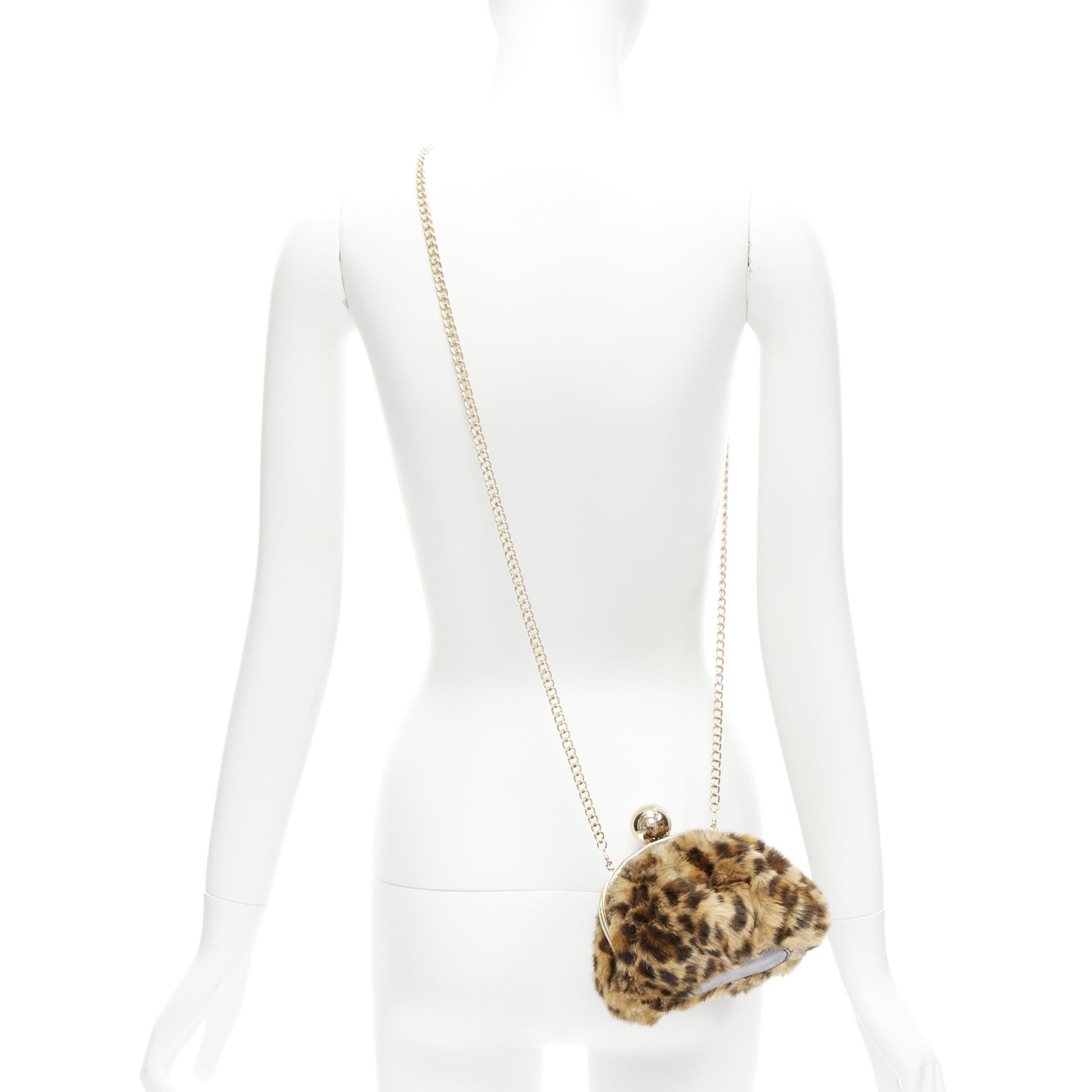 KATE SPADE brown leopard print faux fur gold ball clasp crossbody evening bag
Reference: ANWU/A01078
Brand: Kate Spade
Material: Fabric, Metal
Color: Brown, Gold
Pattern: Leopard
Closure: Clasp
Lining: Beige Fabric
Extra Details: Detachable chain