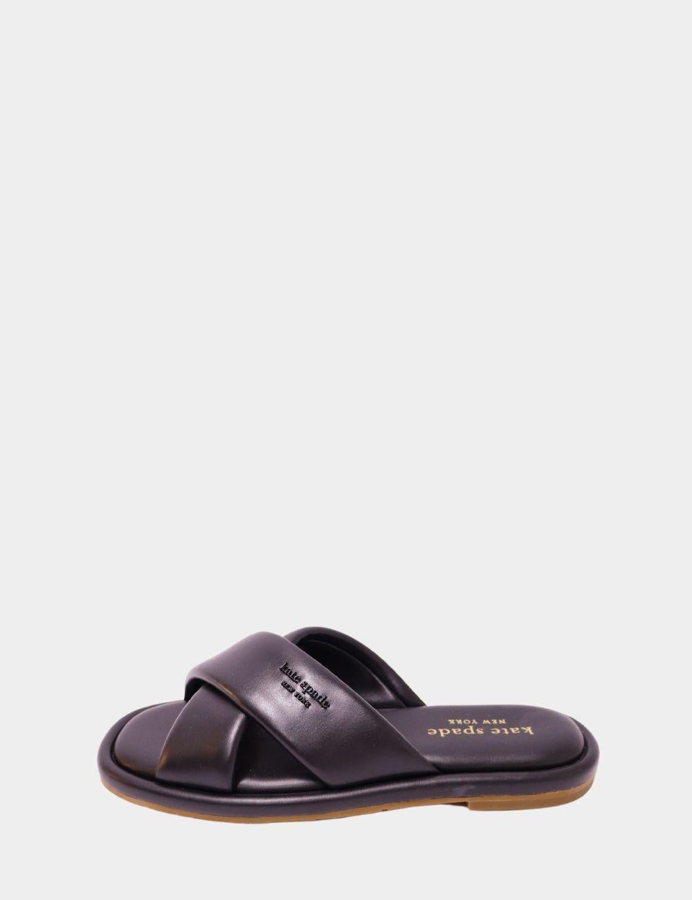 Embrace everyday luxury with these Kate Spade New York Black Criss-Cross Slide Sandals. Designed with a sleek, minimalist silhouette and plush padded straps, these sandals offer chic comfort without sacrificing style. The soft criss-cross upper hugs
