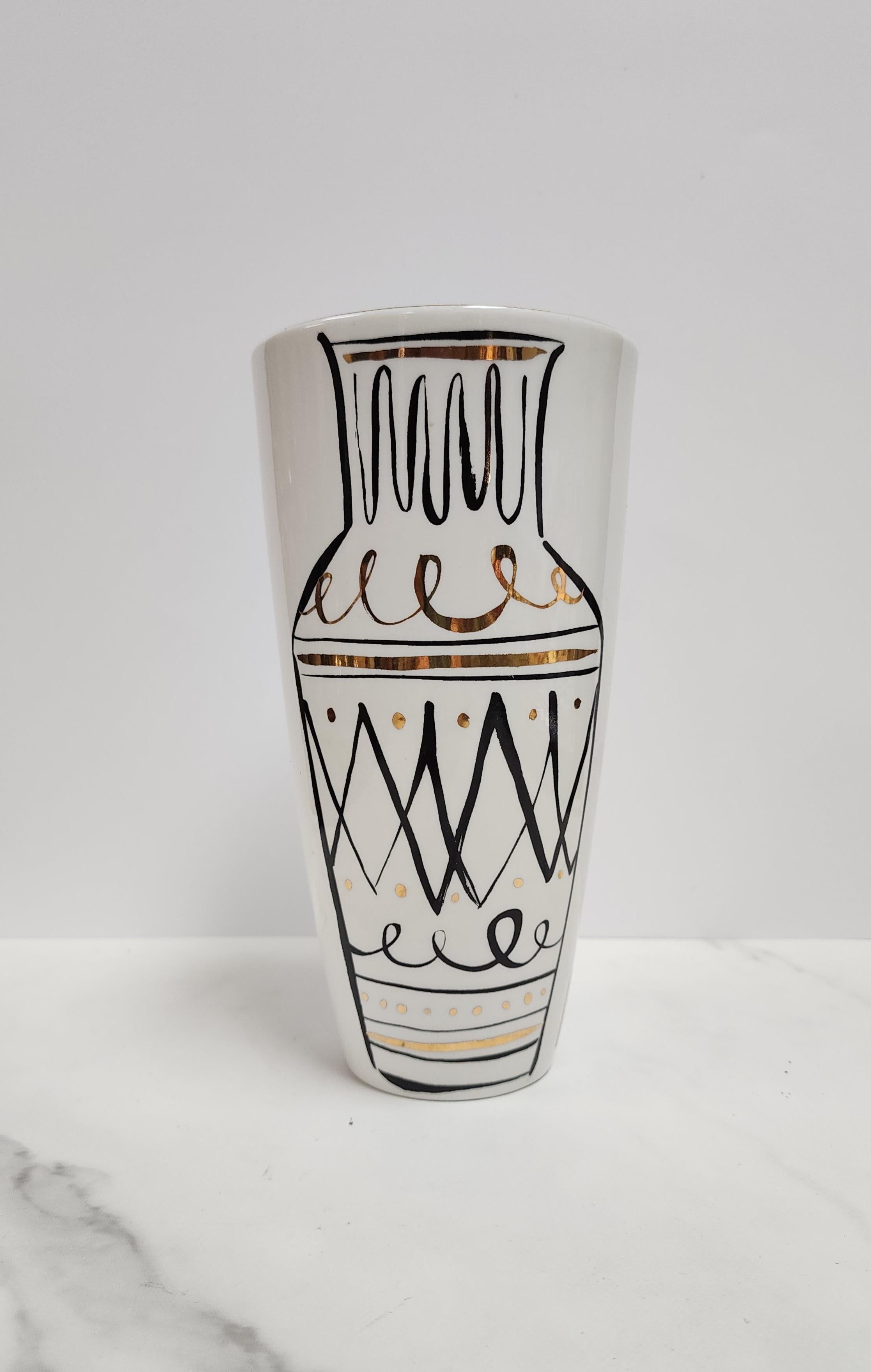 This ivory and gold Lenox vase is from the collaboration with Kate Spade marked Daisy Place Kate Spade New York. The scrafitto style art of a vase within a vase is whimsical with a nod to classic Italian pottery. In excellent condition. 