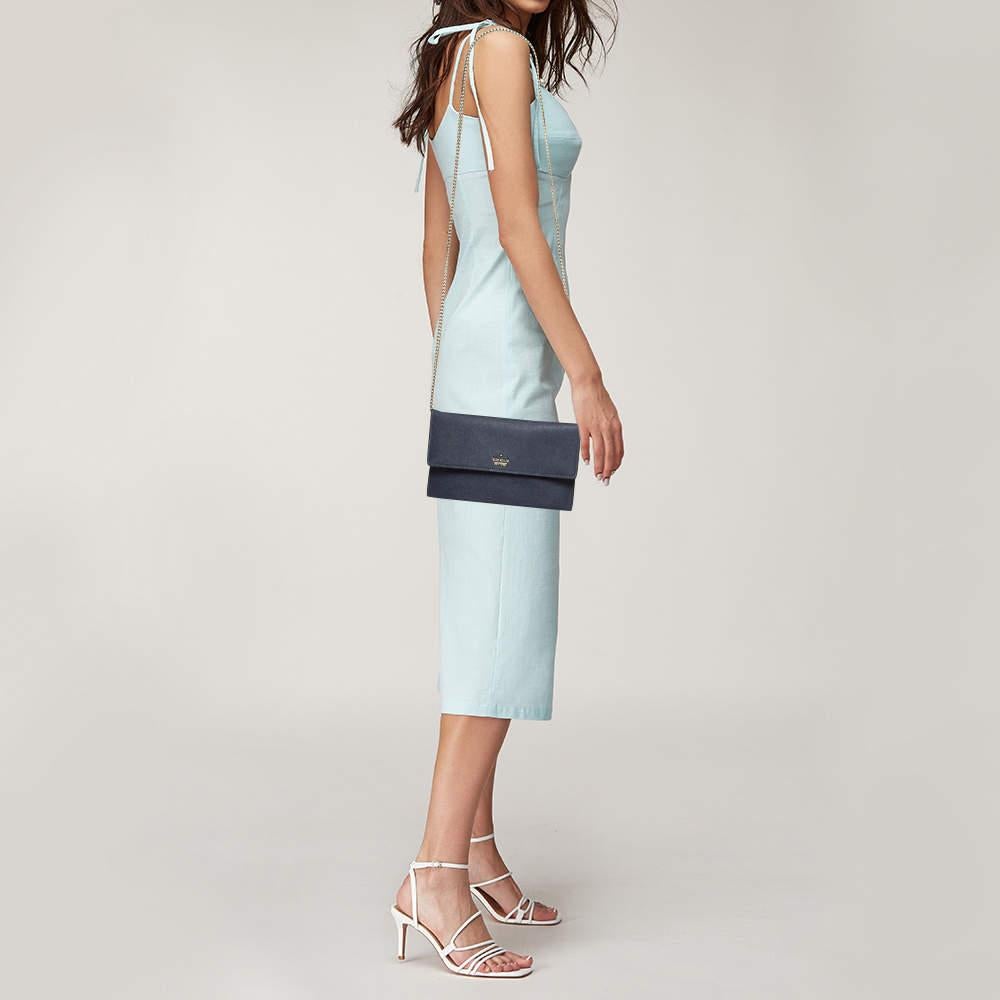 Functional and fashionable, this clutch is a classy styling choice. It is crafted from quality materials, and its lined interior will keep your evening essentials in a neat way. 