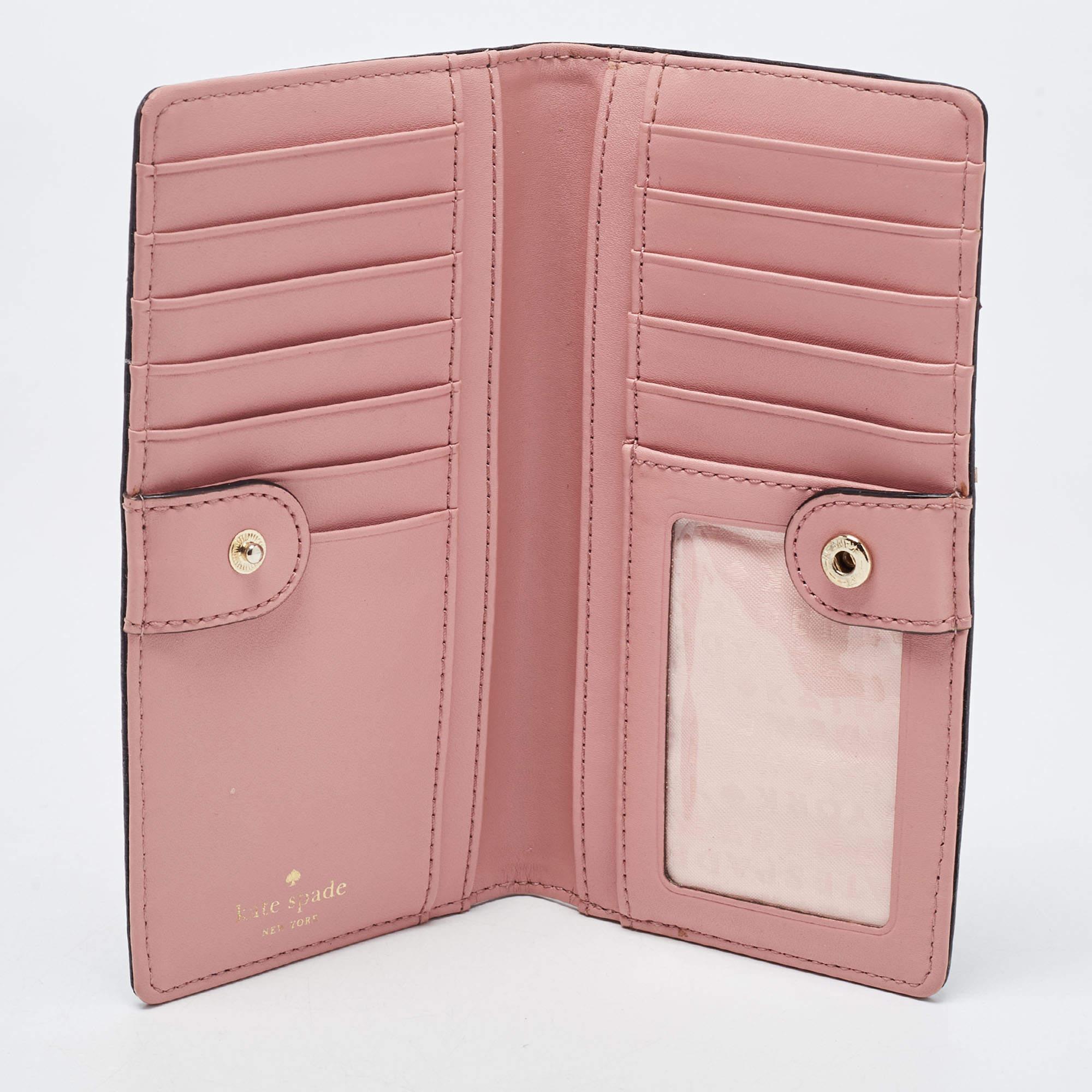 This wallet from Kate Spade brings along a touch of luxury and immense style. It comes crafted from leather and is designed like a bifold with the brand detail on the exterior. It is equipped with compartments and multiple slots so you can neatly