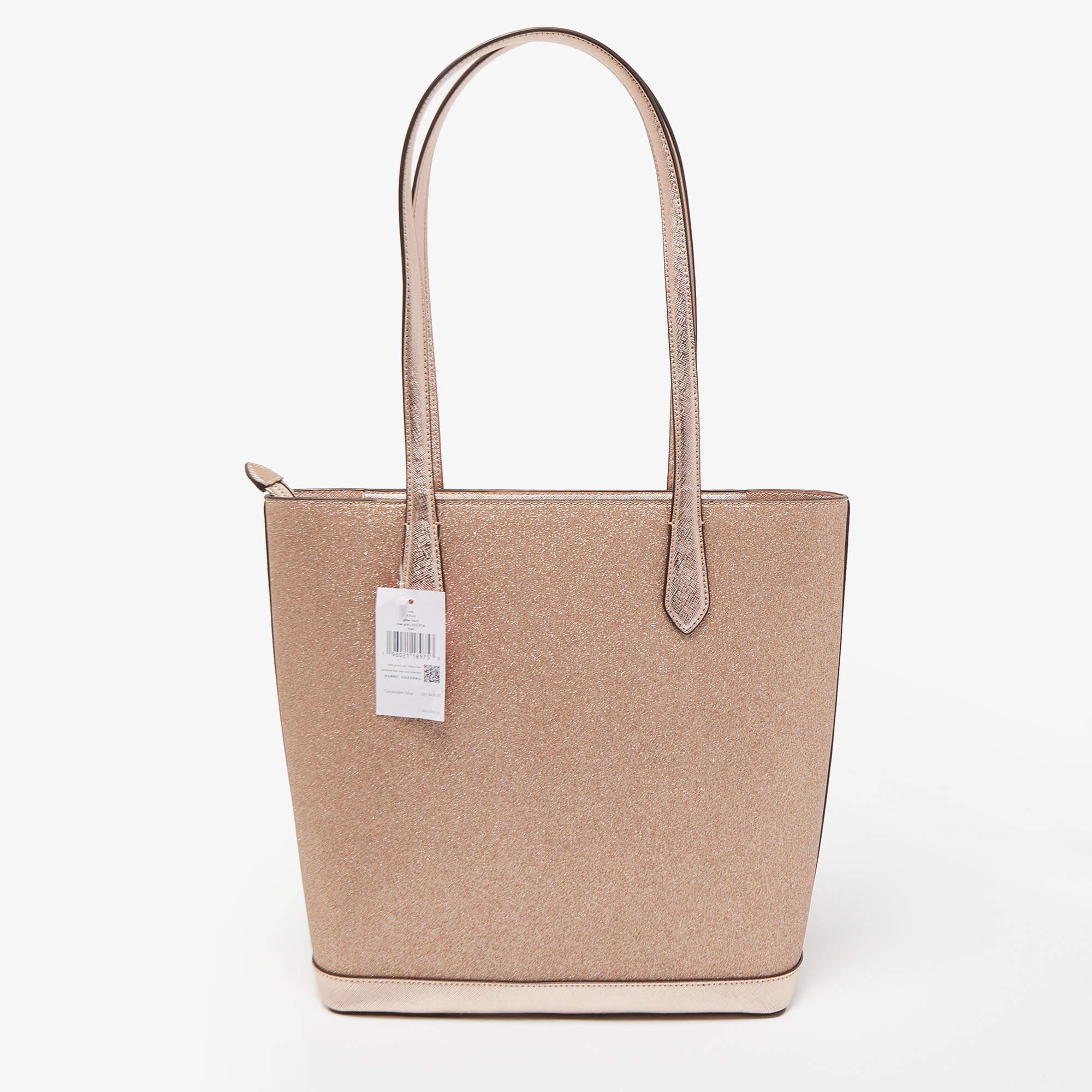 Created from high-quality materials, this tote is enriched with functional and classic elements. It can be carried around conveniently, and its interior is perfectly sized to keep your belongings with ease.

Includes: Brand Tag