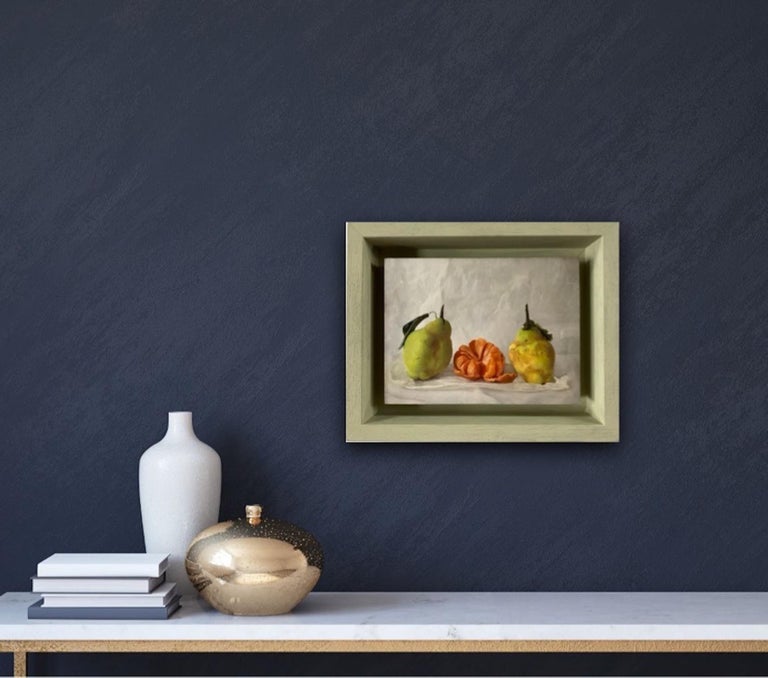 Kate Verrion
Two Pears and a Satsuma
Original Still Life Painting
Oil Paint on Board
Image Size: H 15cm x W 20cm x D 2.5cm
Framed Size: H 21.5cm x W 26.5cm x D 5.5cm
Sold Framed in a Warm Grey Box Frame

Two Pears and a Satsuma is an original still
