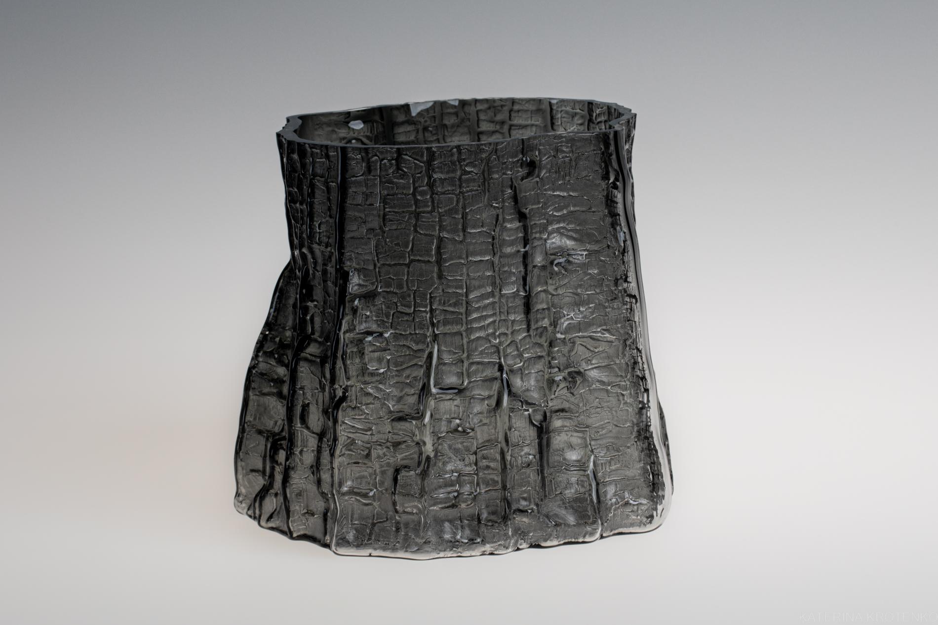 sculptural glass vase, volume IV, smoky dark gray
approximate dimensions: 15–18 cm

Shaped by fire collection of glass vessels represents movement in time, the simultaneity of the past and the future. The making process is a captivating synergy of