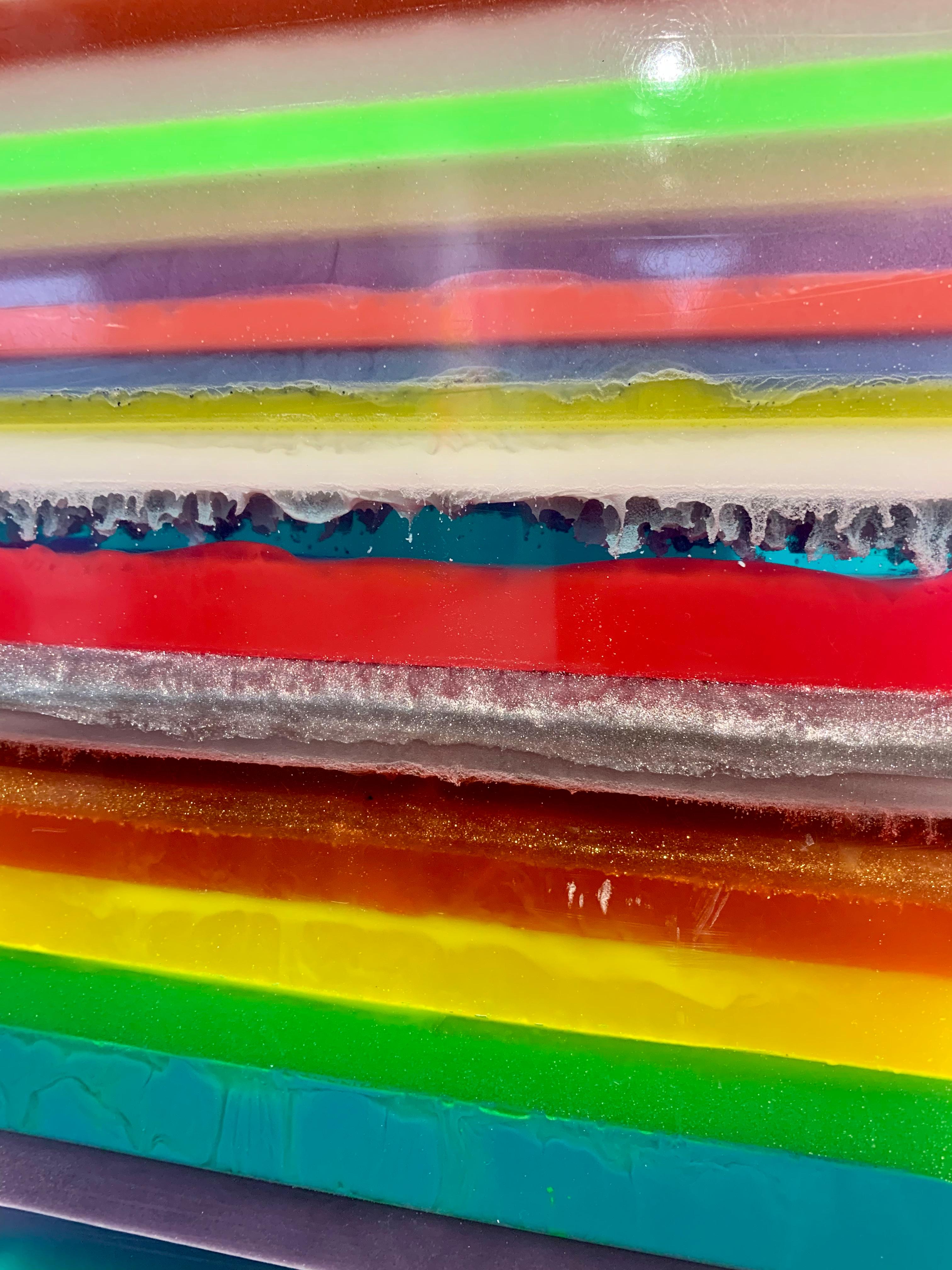 Lines, Crossing Sections, Color Overlays. Life is full of intersections, corners and shades of vibrancy and so are the artworks by Katharina Hormel.
This beautiful epoxy resin sculpture is full of details, colors intermingling and speaks a clear