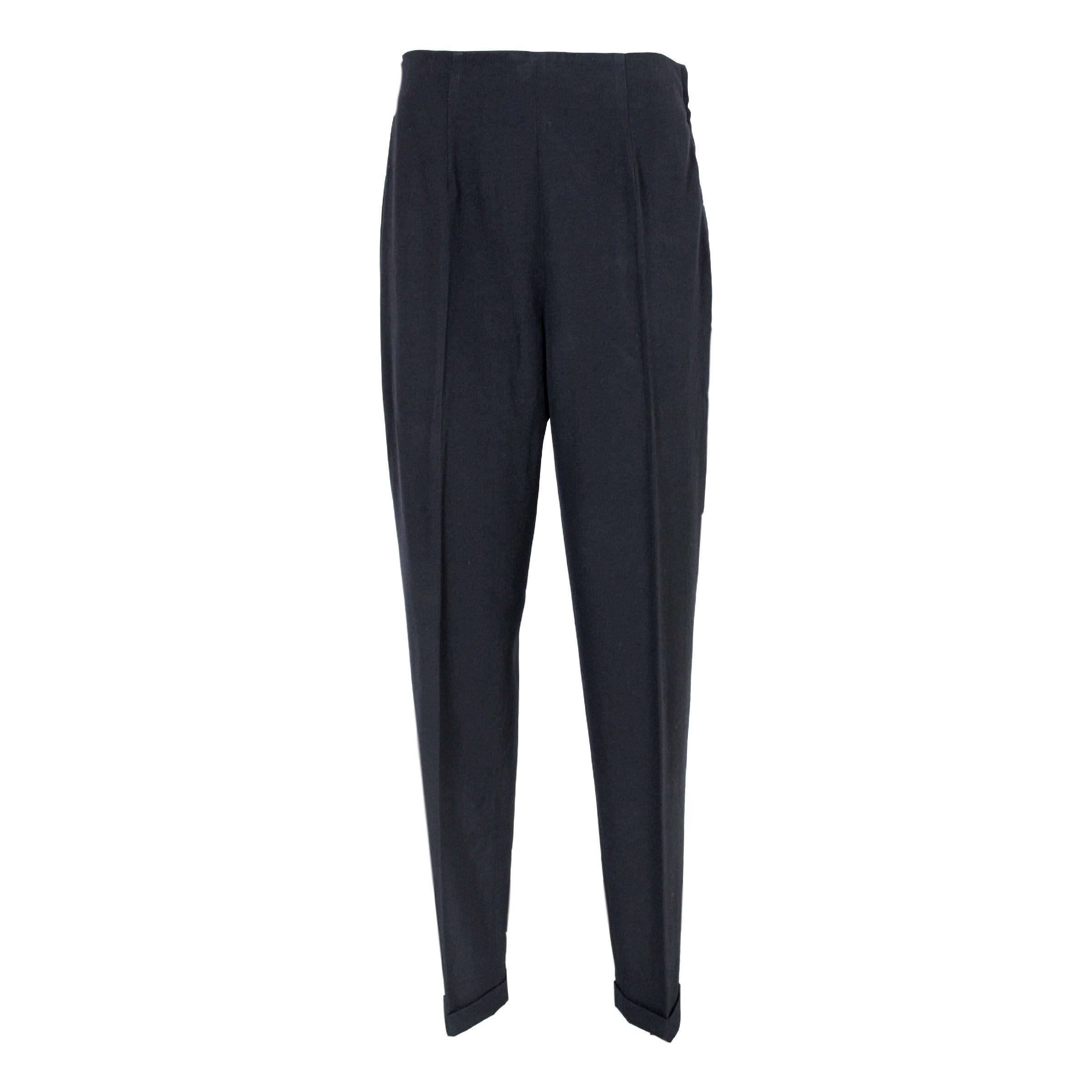 Katharine Hamnett women's vintage trousers - a timeless piece that exudes elegance and sophistication. Crafted from 100% wool and made in Italy, these trousers feature a straight palace model, high waist design, and come in classic black color.