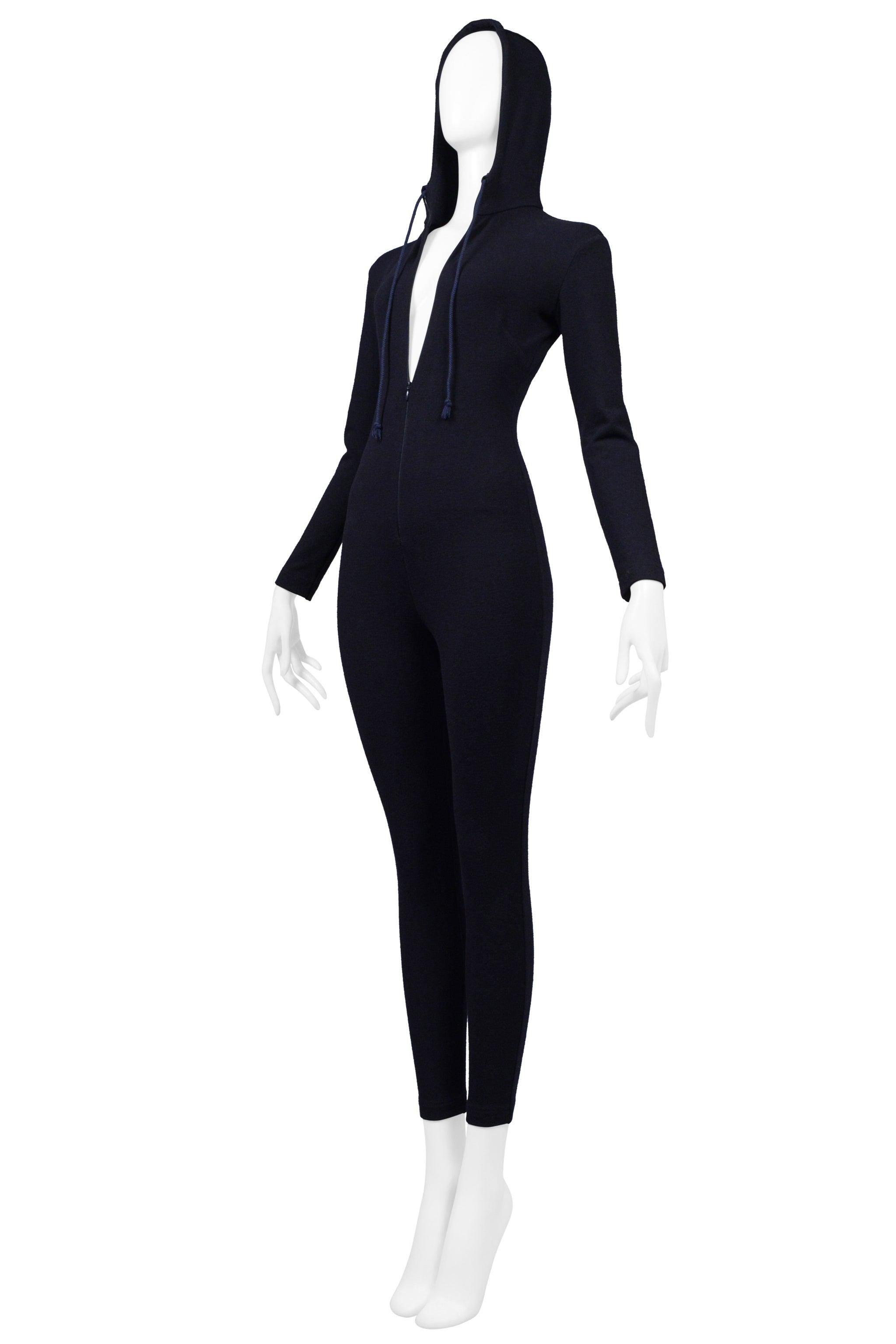 Resurrection Vintage is delighted to offer a vintage Katharine Hamnett dark navy jersey jumpsuit with stretch featuring a center front zipper, and hood. 

* Katharine Hamnett
* Size Small or 2-4 (No Label)
* Fabric: Wool Jersey with Stretch (No
