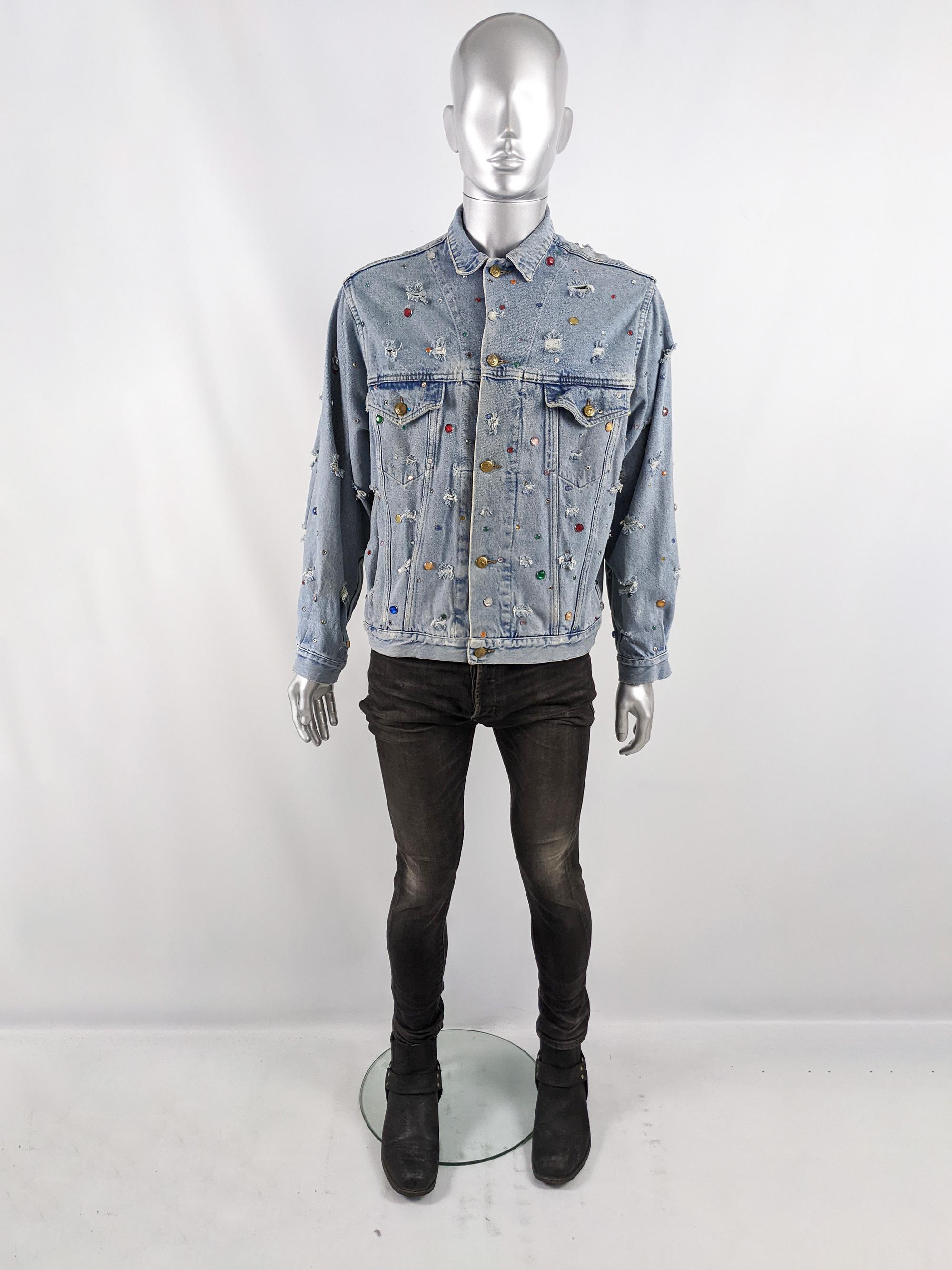 An incredible vintage mens Katherine Hamnett denim jacket from the 80s. In a blue denim with distressing / frayed rips and studs throughout (some with different coloured beads, some left unbeaded and different sizes). It has interesting buttons and
