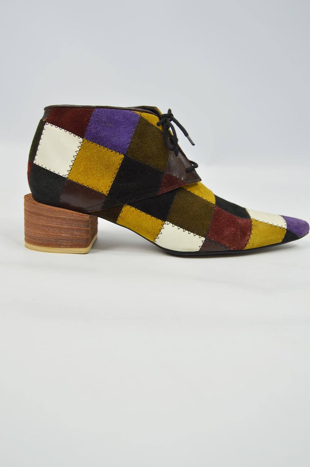 A fabulous pair of vintage Katharine Hamnett ankle boots made in collaboration with London label Shellys who also worked with Westwood and Gaultier in the 90s. Made from a patchwork of suedes and leathers for a witchy / hippie luxe feel. With a