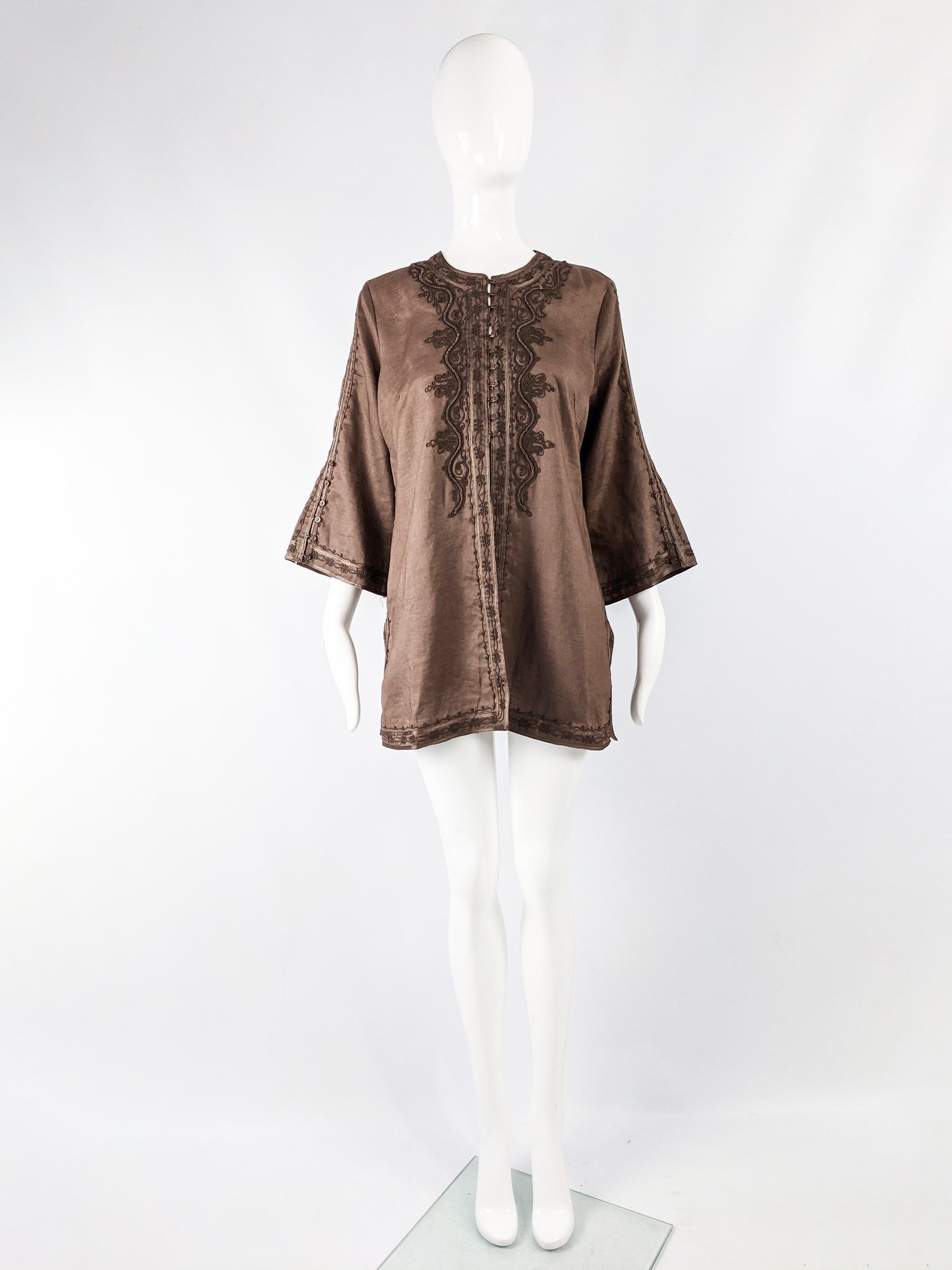 A fabulous womens vintage long sleeve boho shirt from the 90s by iconic British fashion designer, Katherine Hamnett. In a brown linen fabric with long sleeves that flare out and amazing Asian style embroidery / couching which gives a luxe hippie