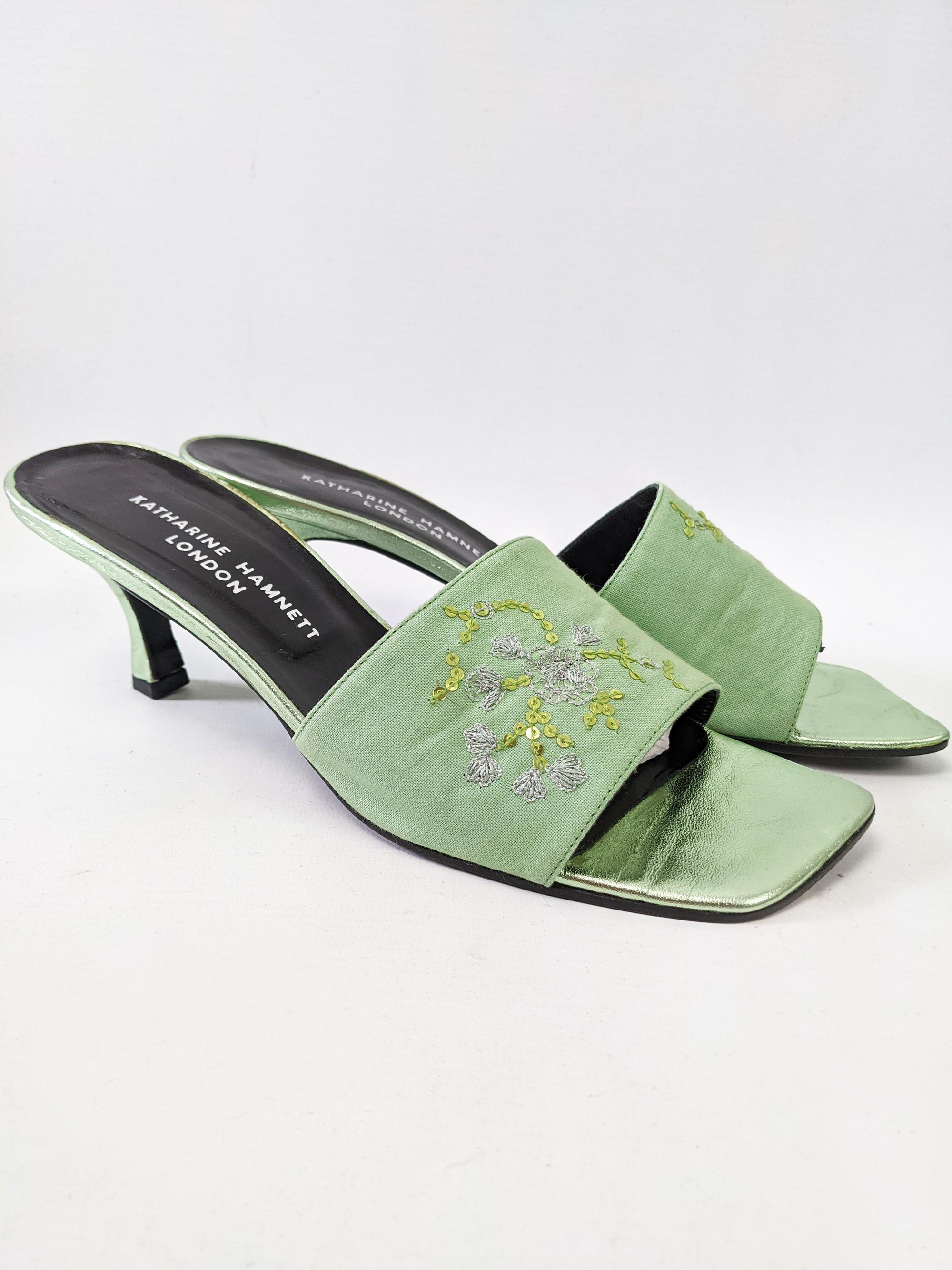 A stunning pair of vintage low heel mules from the late 90s by luxury British fashion designer, Katherine Hamnett.  Made in Italy, from a green leather with a wide cotton strap and beautiful sequin and embroidery detailing. 

Size: Marked IT