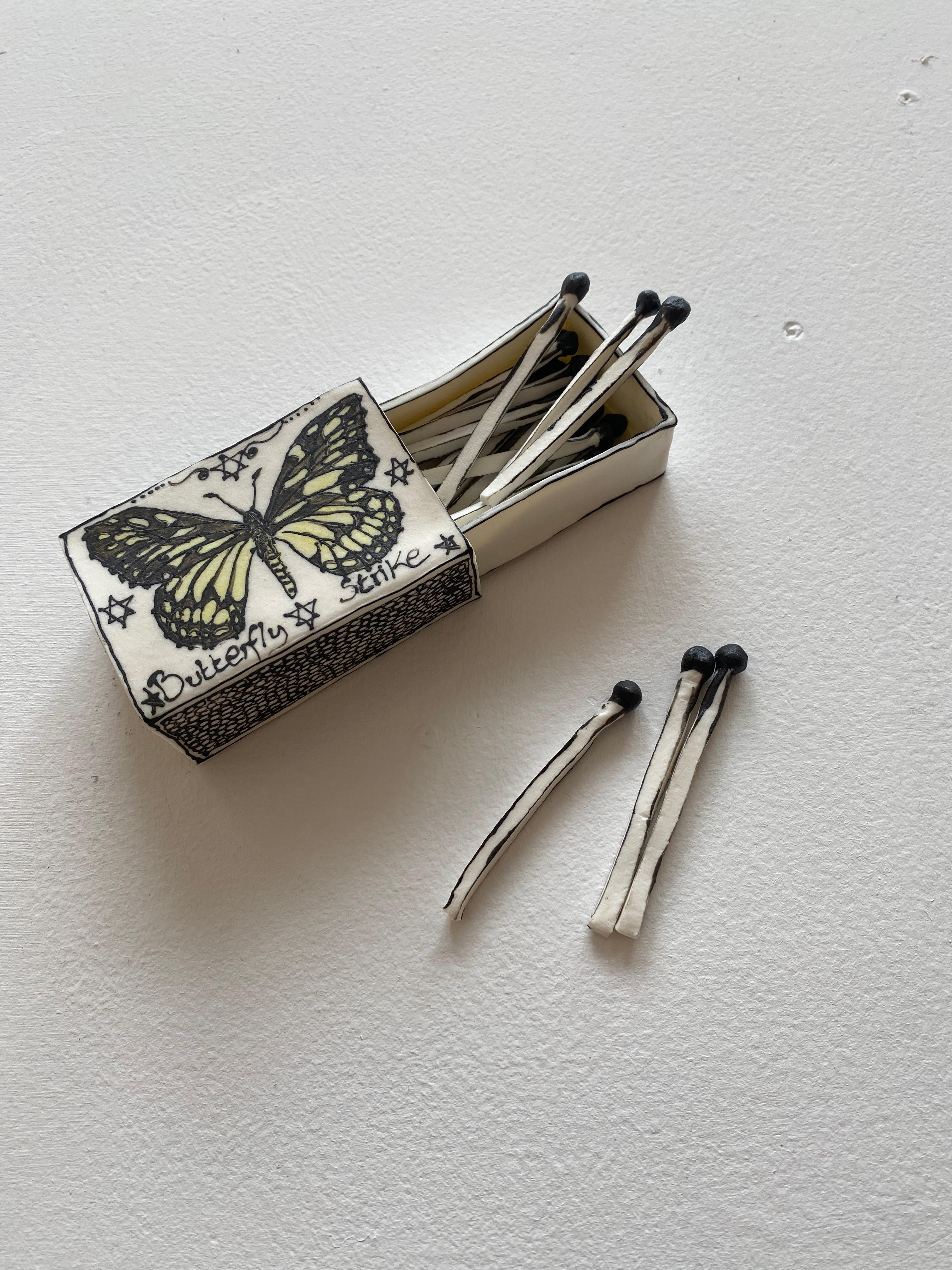 Butterfly Matchbox: Black & white porcelain ceramic pop surreal sculpture - Contemporary Sculpture by Katharine Morling