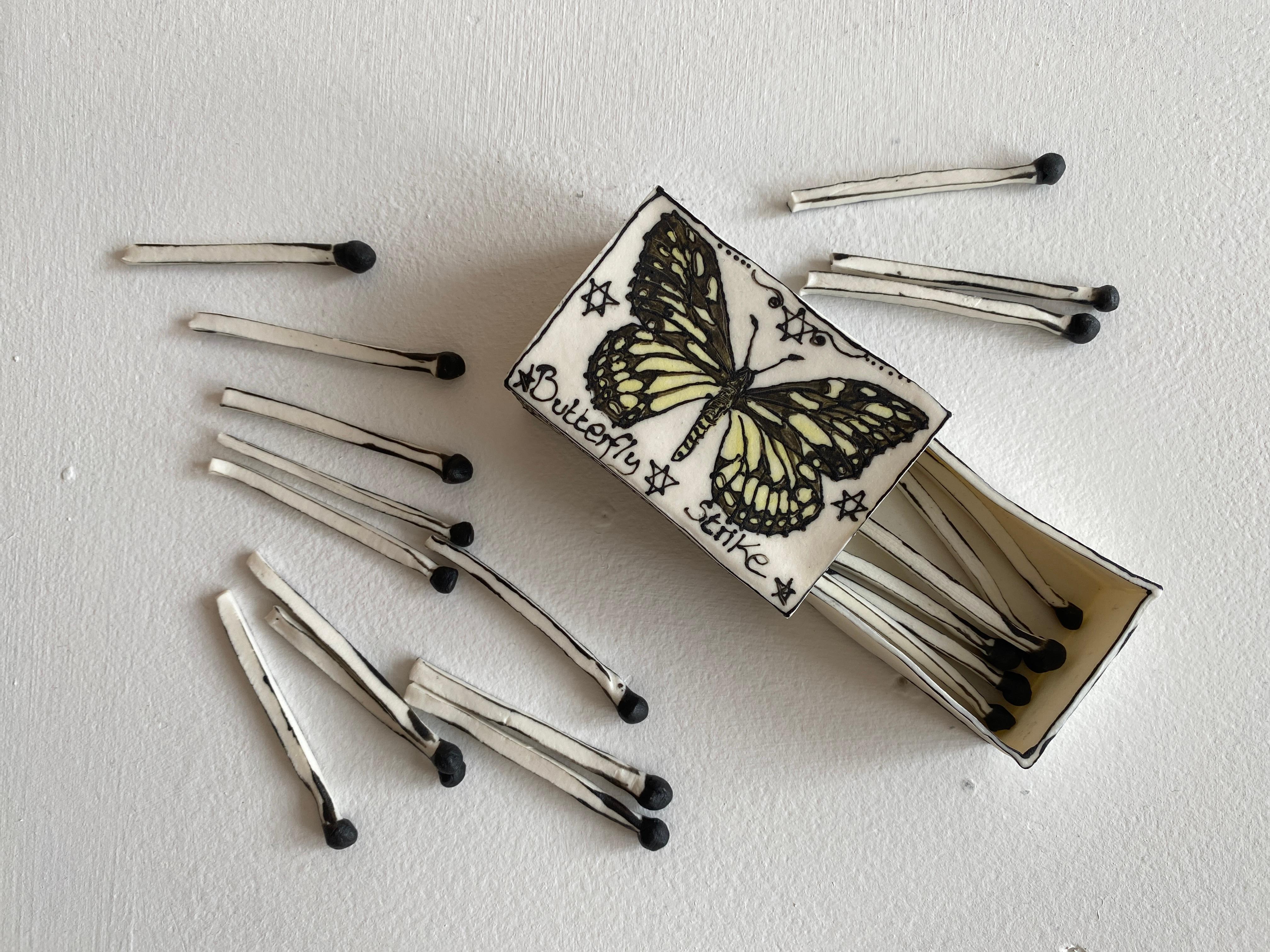 Butterfly Matchbox: Black & white porcelain ceramic pop surreal sculpture - Gray Still-Life Sculpture by Katharine Morling