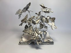 Freedom, handmade porcelain sculpture of butterflies coming out of a book