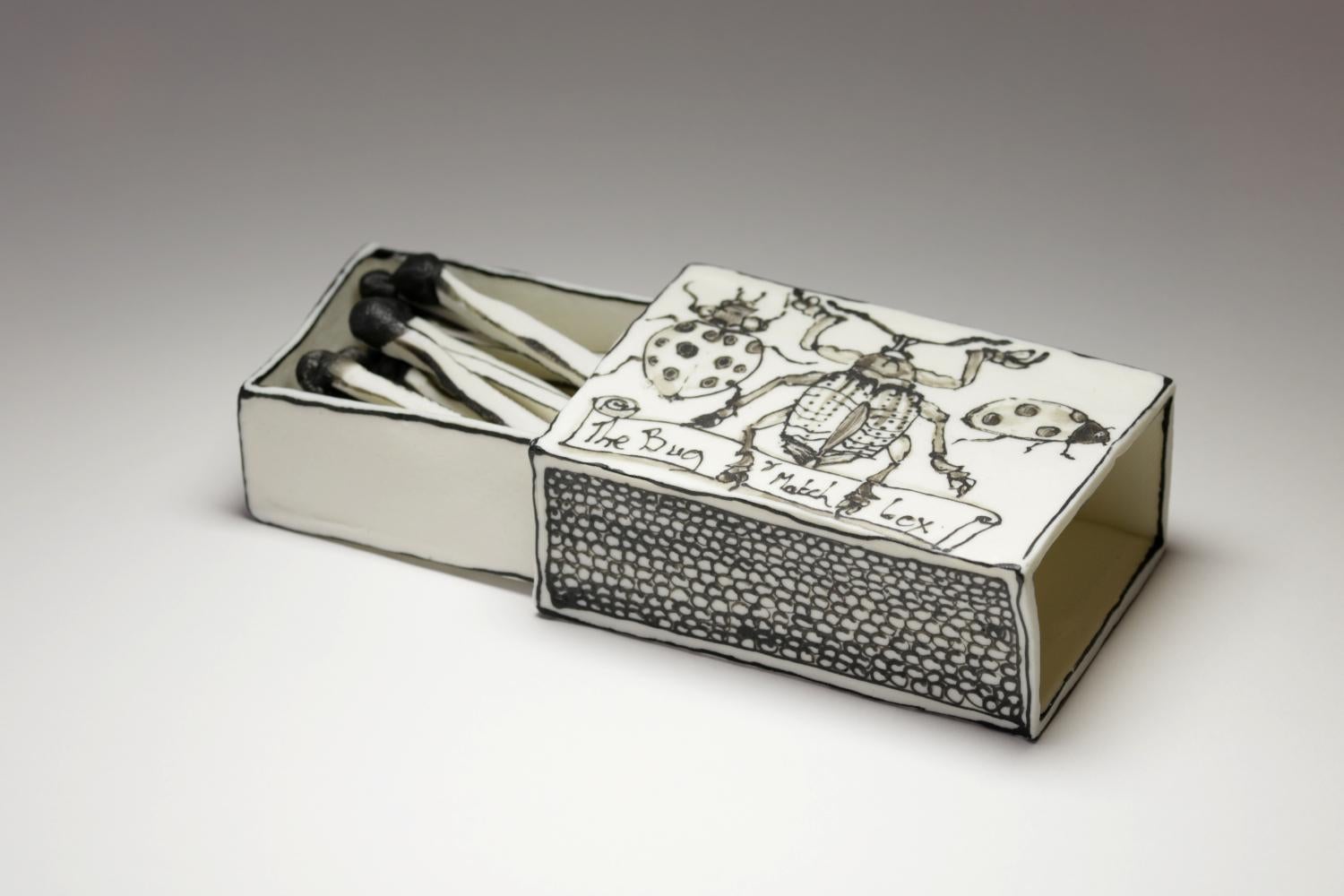 Bug Matchbox II: Black & white porcelain ceramic pop surreal drawing sculpture - Sculpture by Katharine Morling
