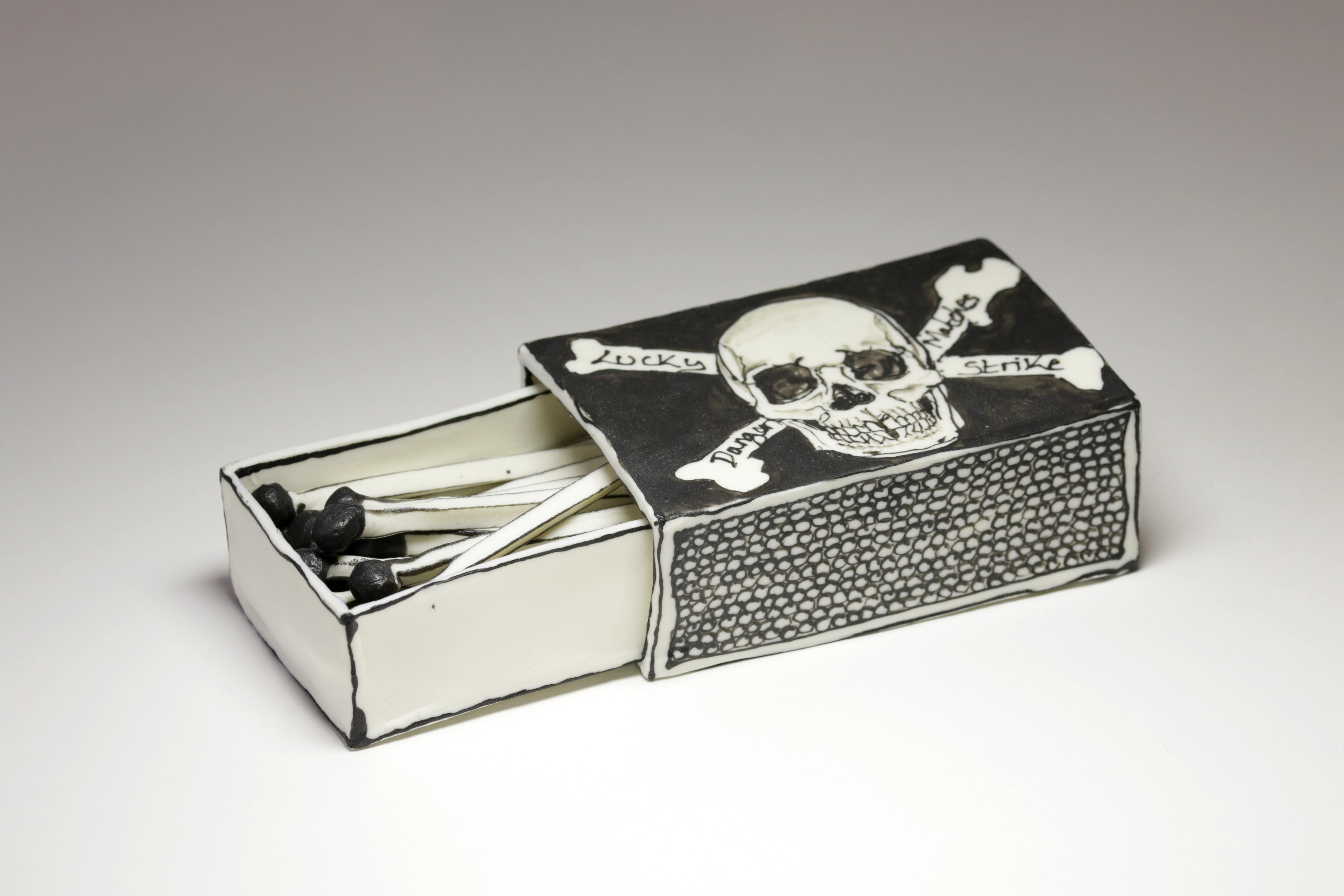 Skull Matchbox: Black & white porcelain ceramic pop surreal sculpture - Sculpture by Katharine Morling