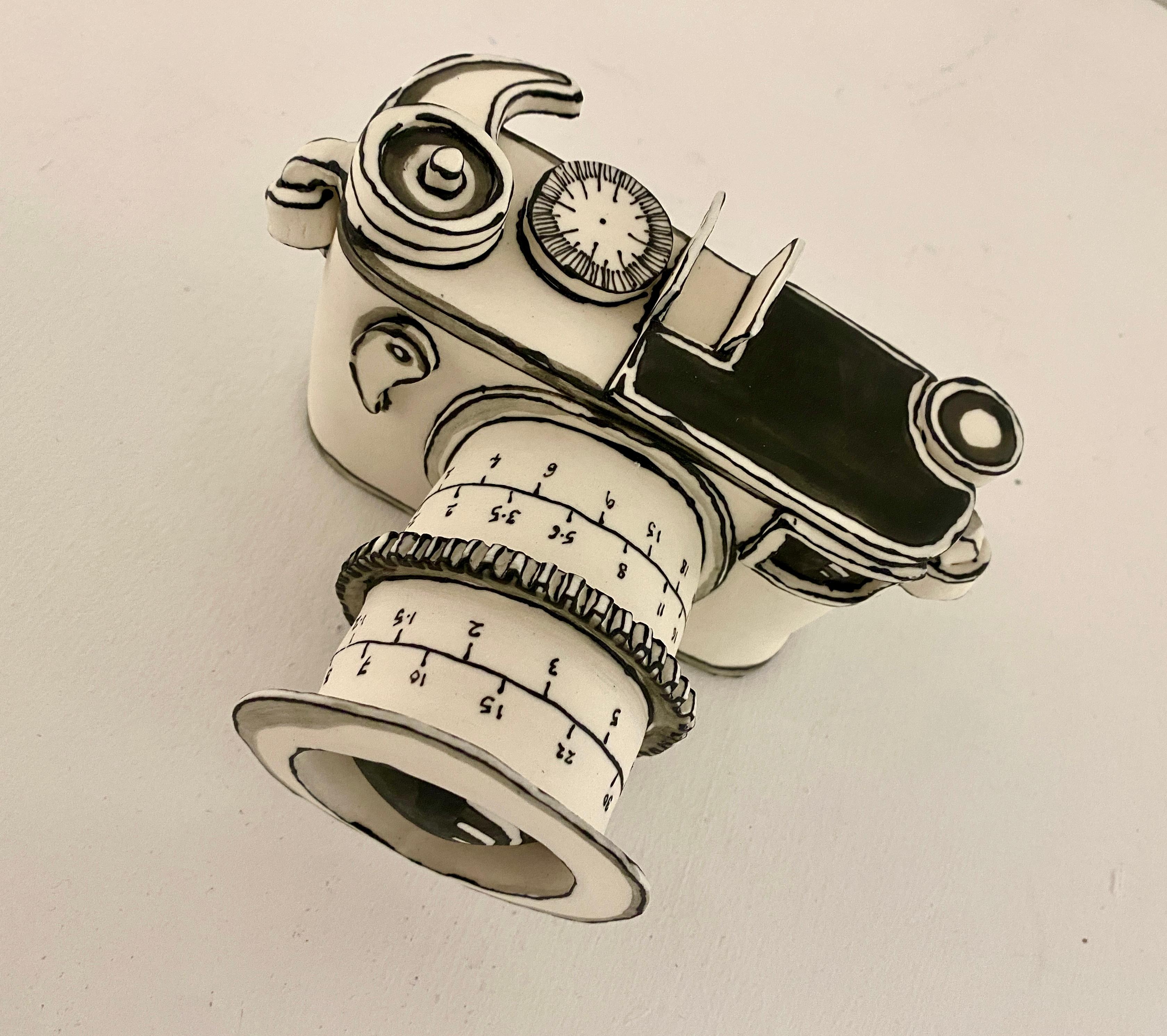 The Original Camera, handmade porcelain sculpture in black and white - Black Still-Life Sculpture by Katharine Morling