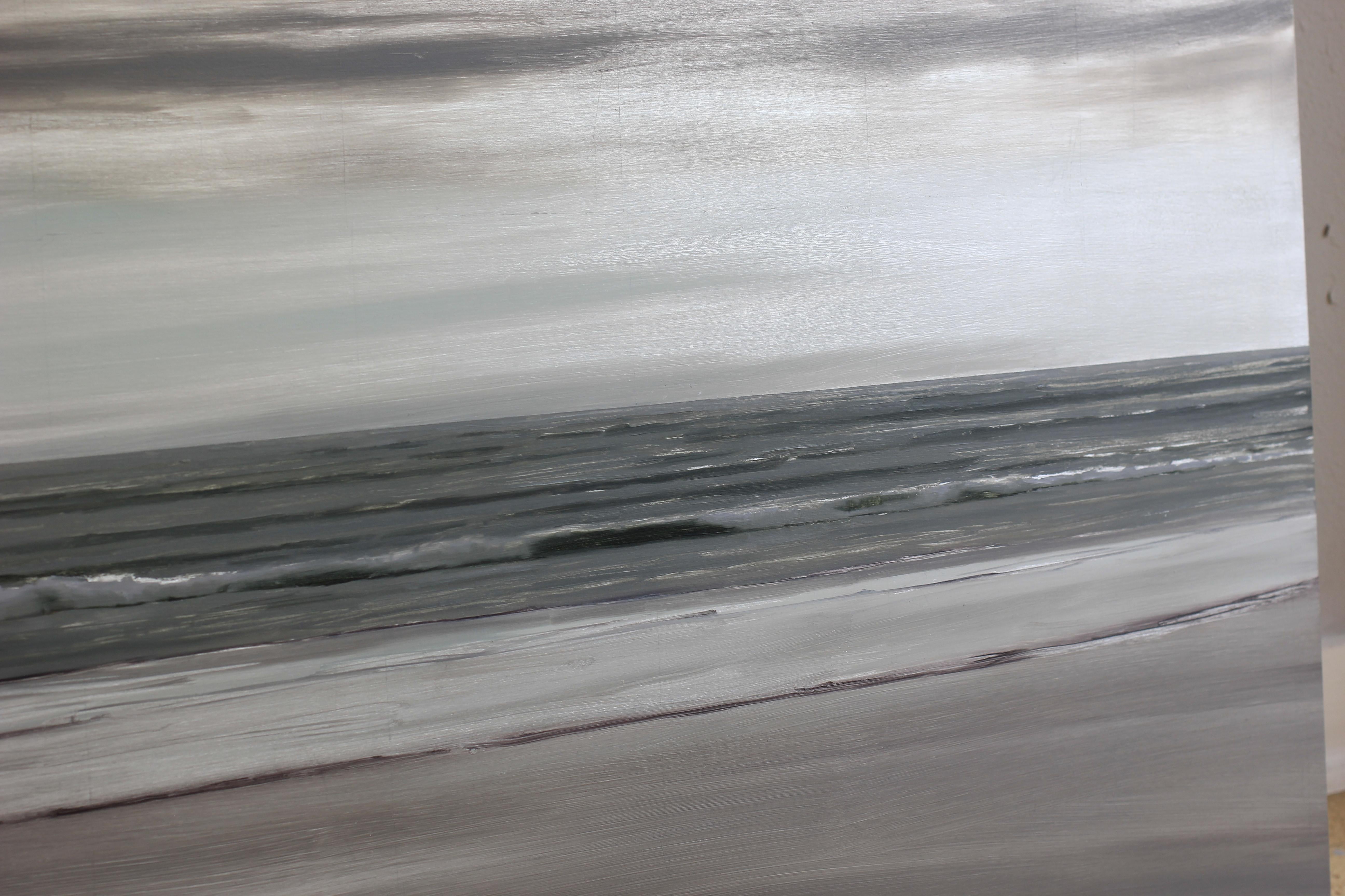 The Calm Remains pairs the reflective and scintillating quality of silver with the heavy grey of fog and ocean onshore breeze. White paint defines the horizon, waveforms, froth and reflections on sand, but the panel is not completely