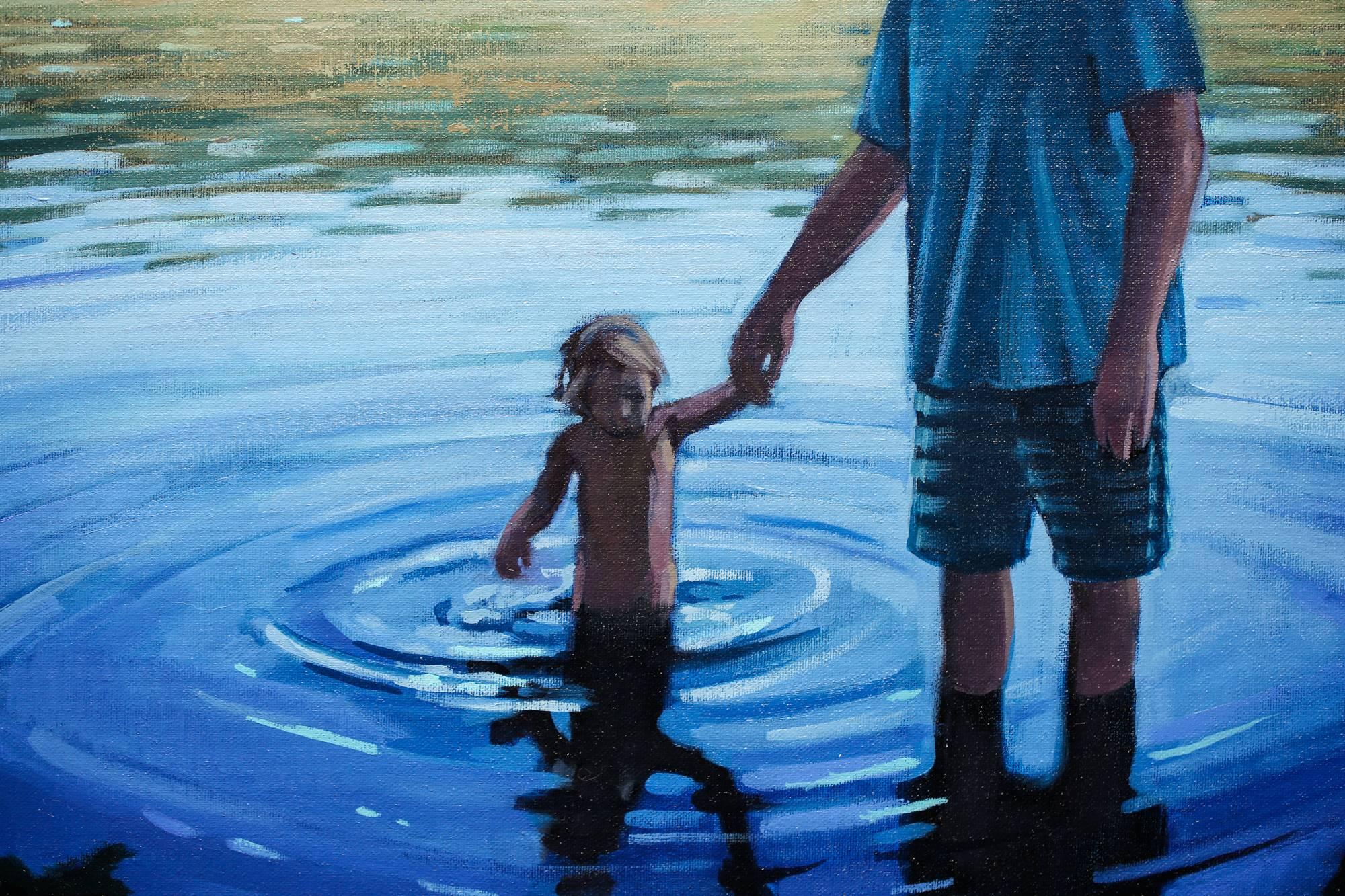 father holding son painting